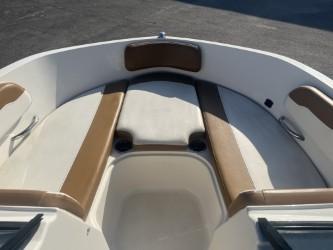 2022 Bayliner VR6 boat interior with tan and white seating.