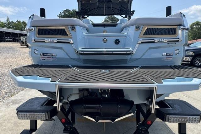 2026 MasterCraft XStar 25 boat rear view with swim platform and sleek design.