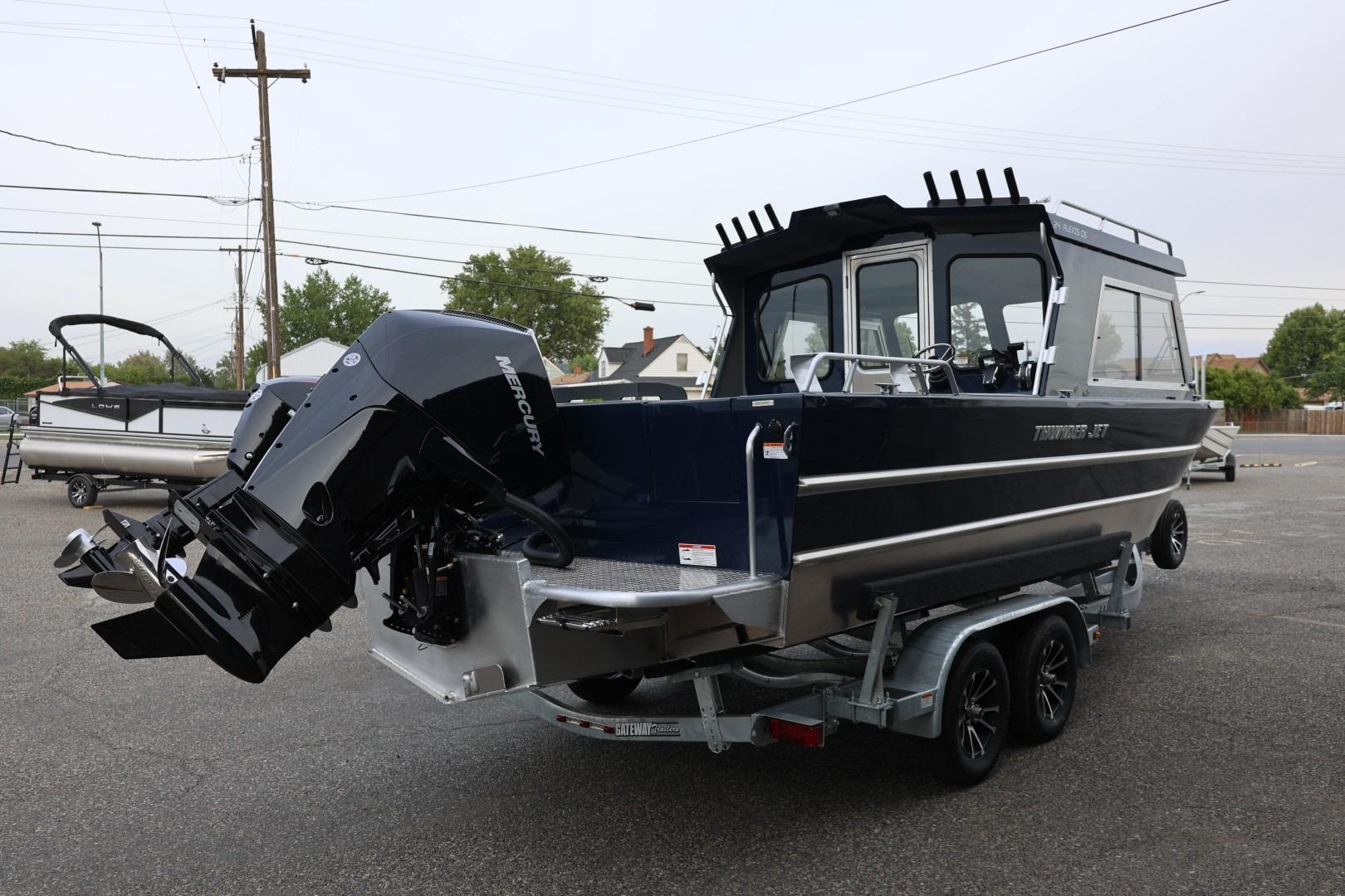 2026 Thunder Jet 24 Alexis Pro boat on trailer, featuring a powerful Mercury outboard motor.