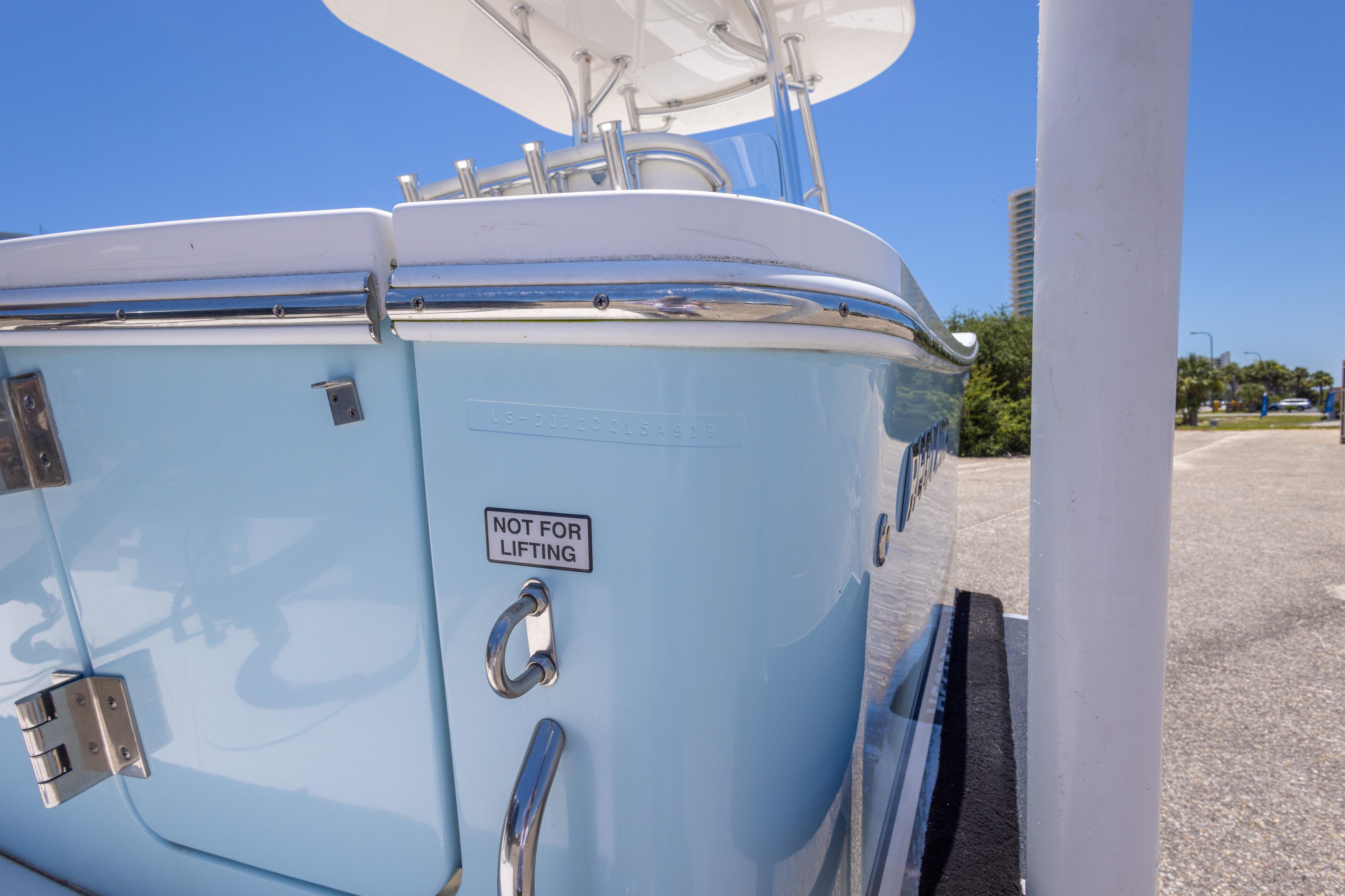 2019 Regulator 23 Center Console boat, light blue hull, "Not for Lifting" label visible.