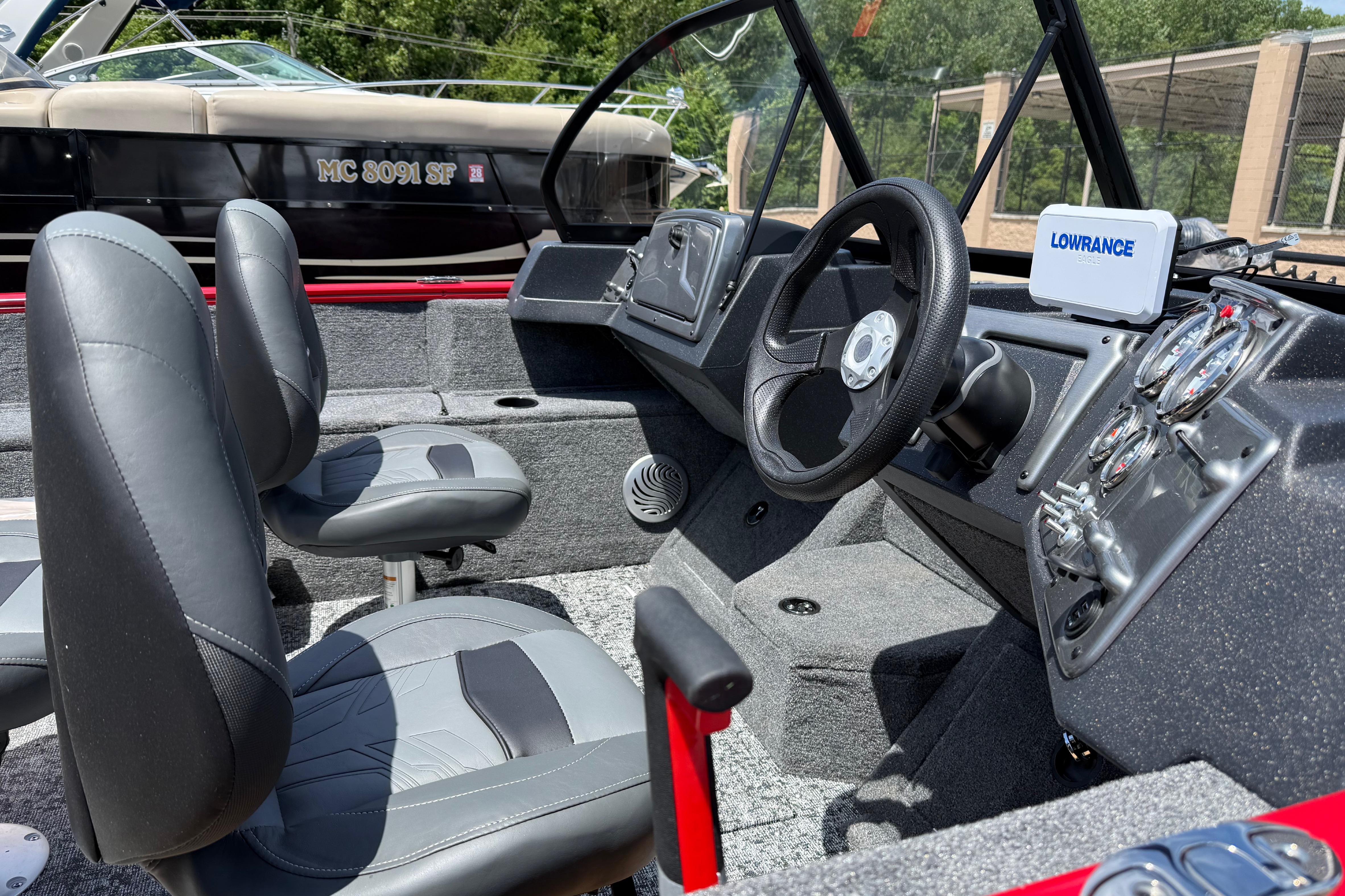 2026 Tracker Pro Guide V-175 Combo boat interior with steering wheel and navigation system.