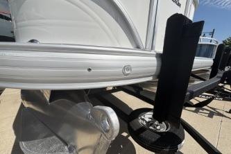 2026 Sun Tracker Party Barge 16 DLX on trailer, close-up view.