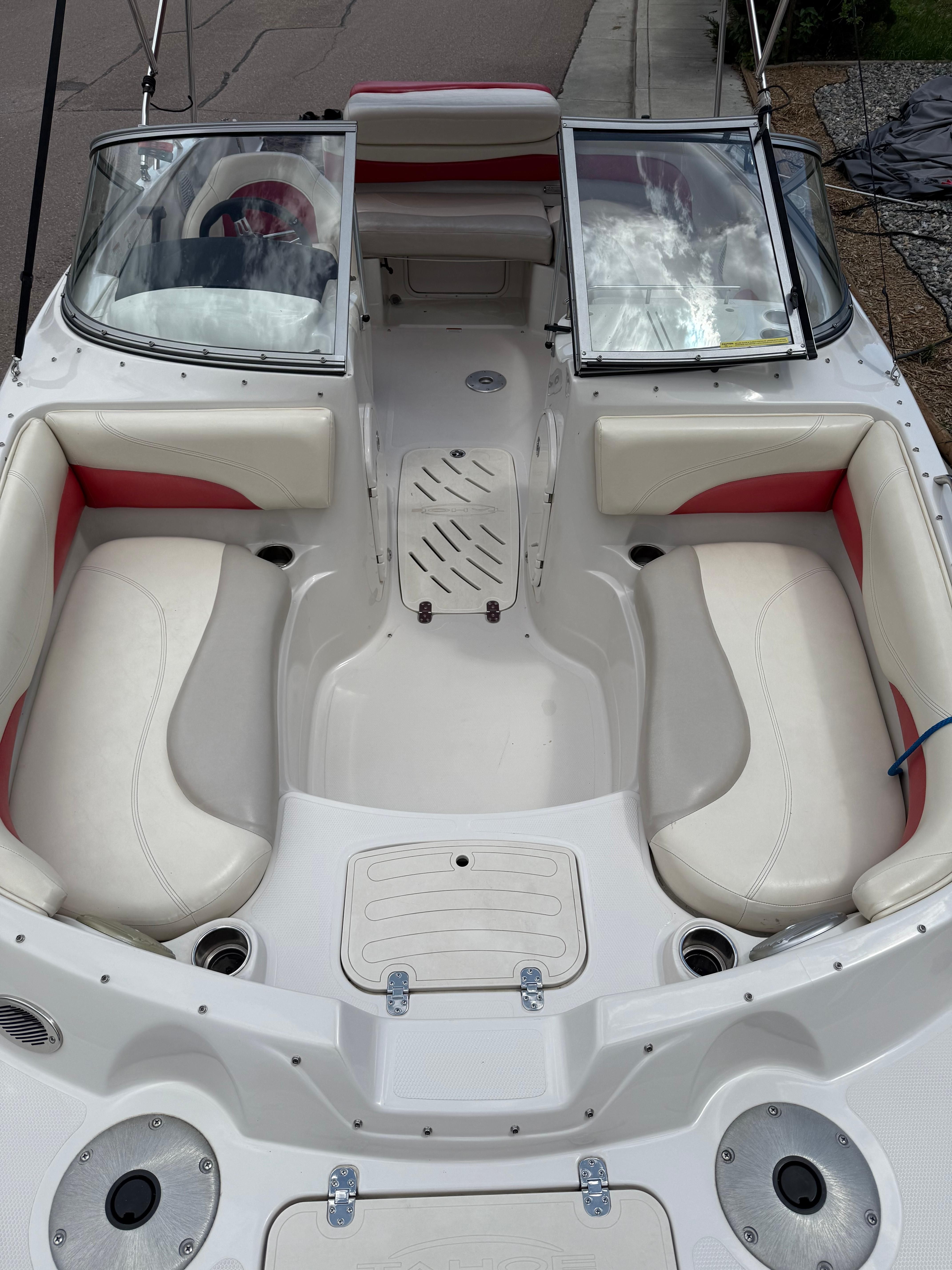 Interior of a 2011 Tahoe 216 WT boat with white seating.