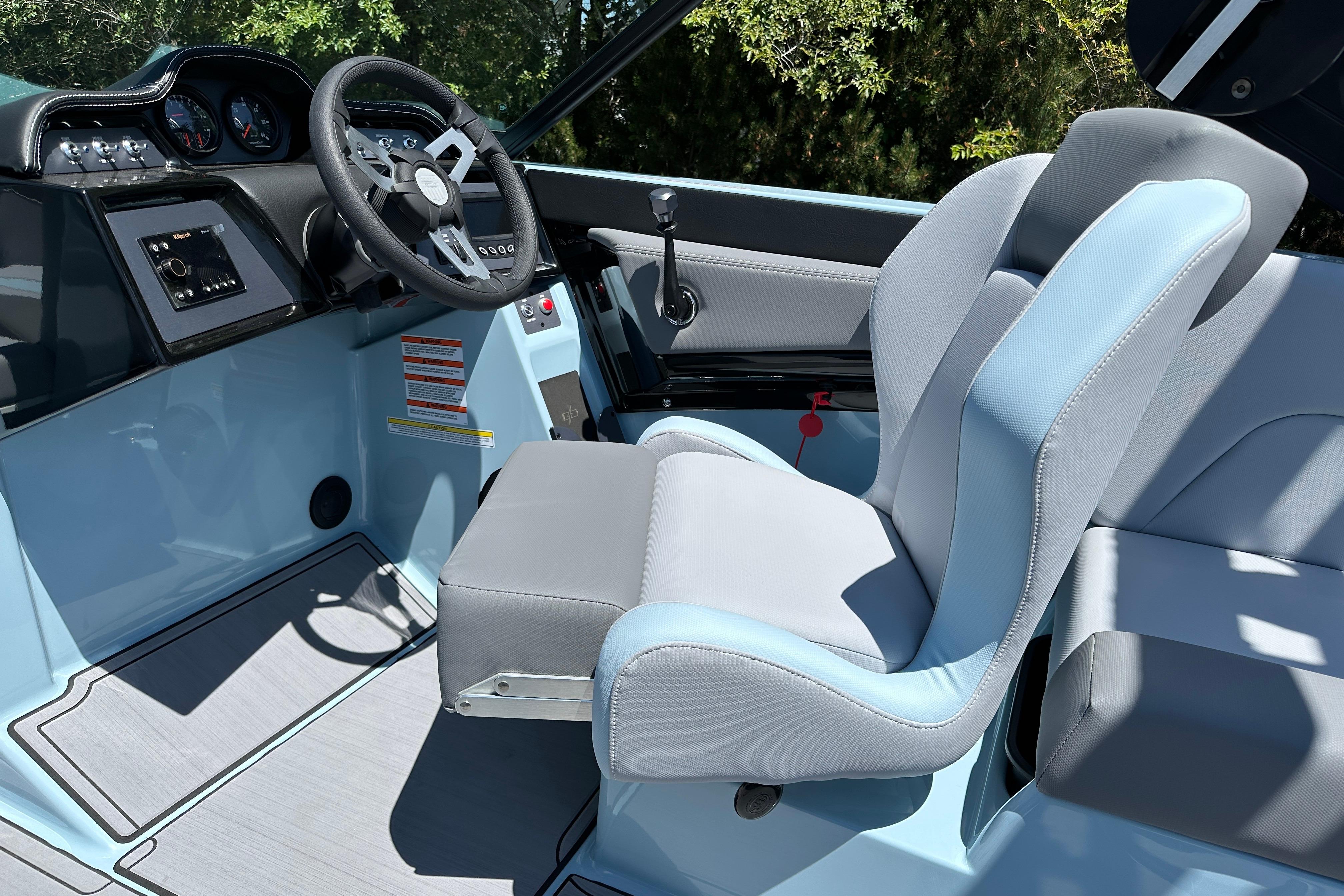2023 MasterCraft NXT23 boat interior with modern steering and seating.