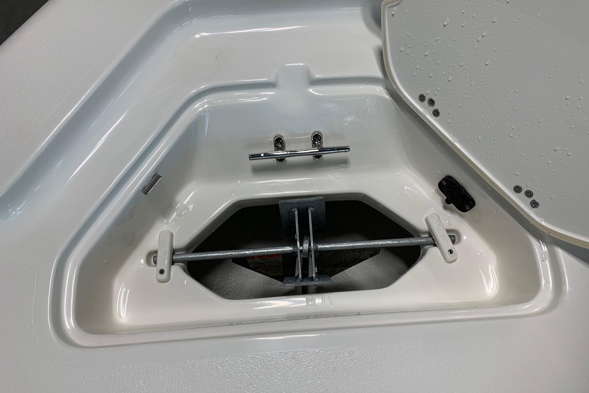 Anchor storage compartment on 2026 Key West 188 Bay Reef boat, open lid, white interior.