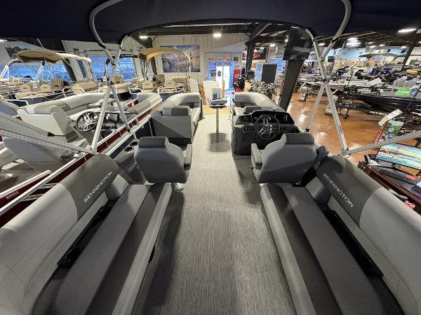 Interior of a 2025 Bennington 20 pontoon boat, showcasing spacious seating and modern design.