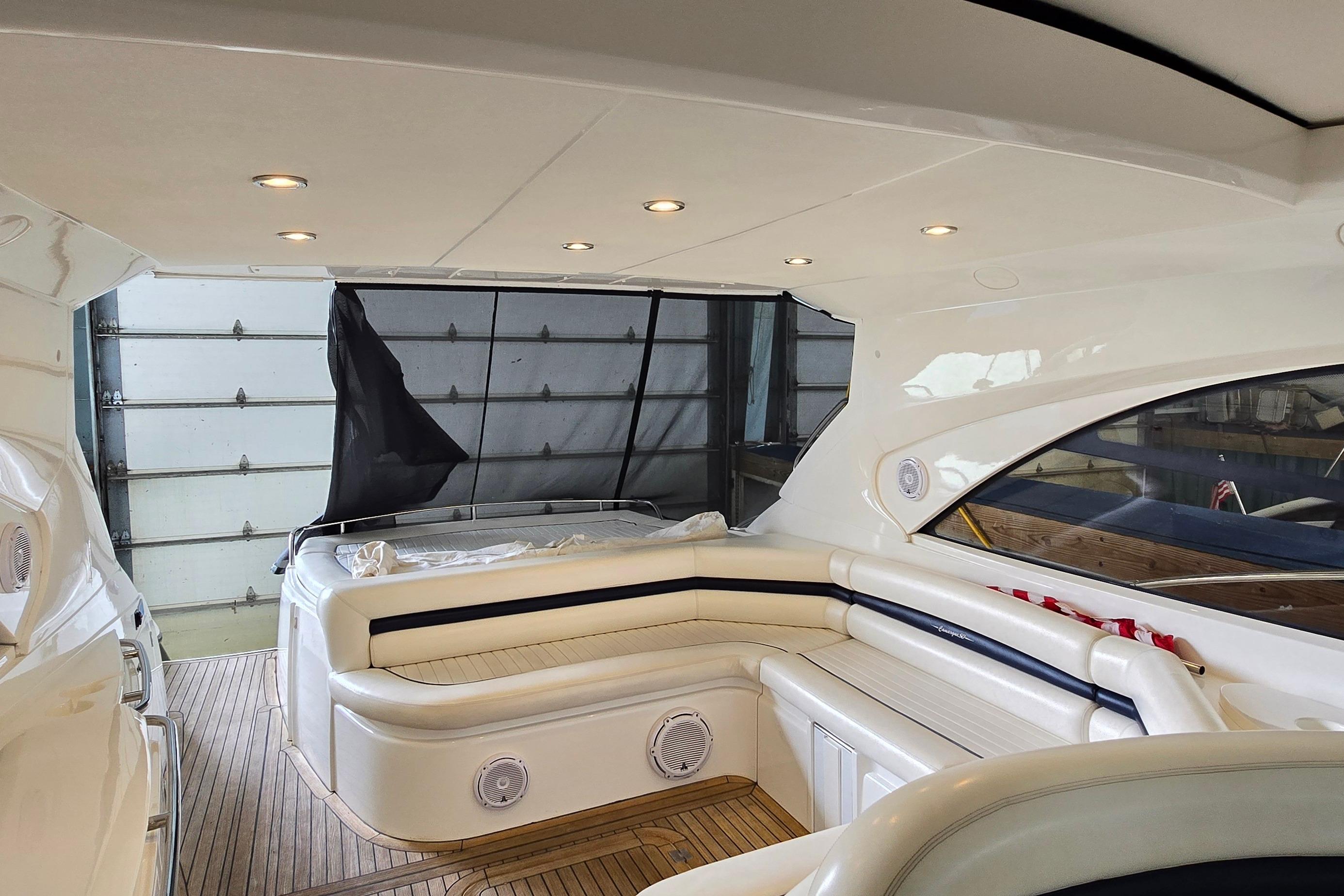 Interior of 2004 Sunseeker Camargue 50 yacht with elegant seating and modern lighting.