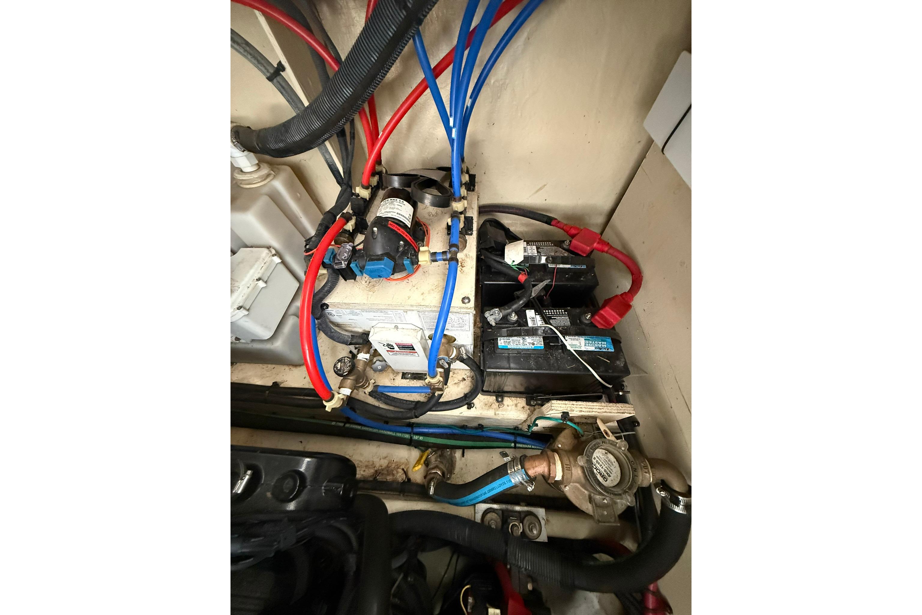 Engine compartment of a 2009 Sea Ray 350 Sundancer with visible wiring and components.