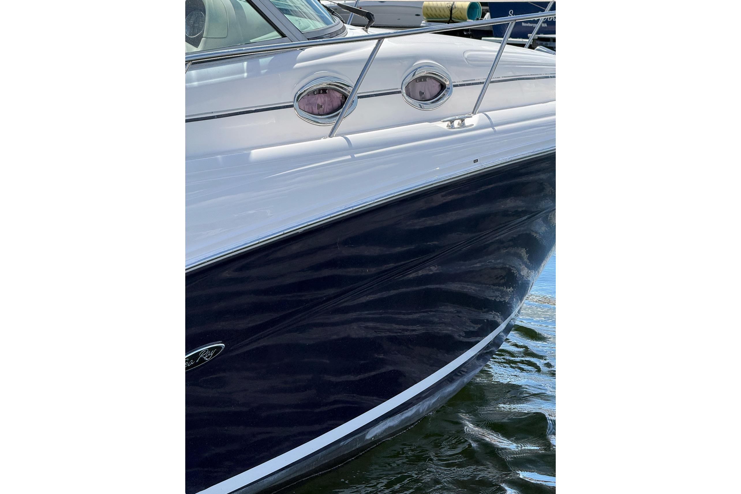 2006 Sea Ray 300 Sundancer boat with sleek design, docked on water.