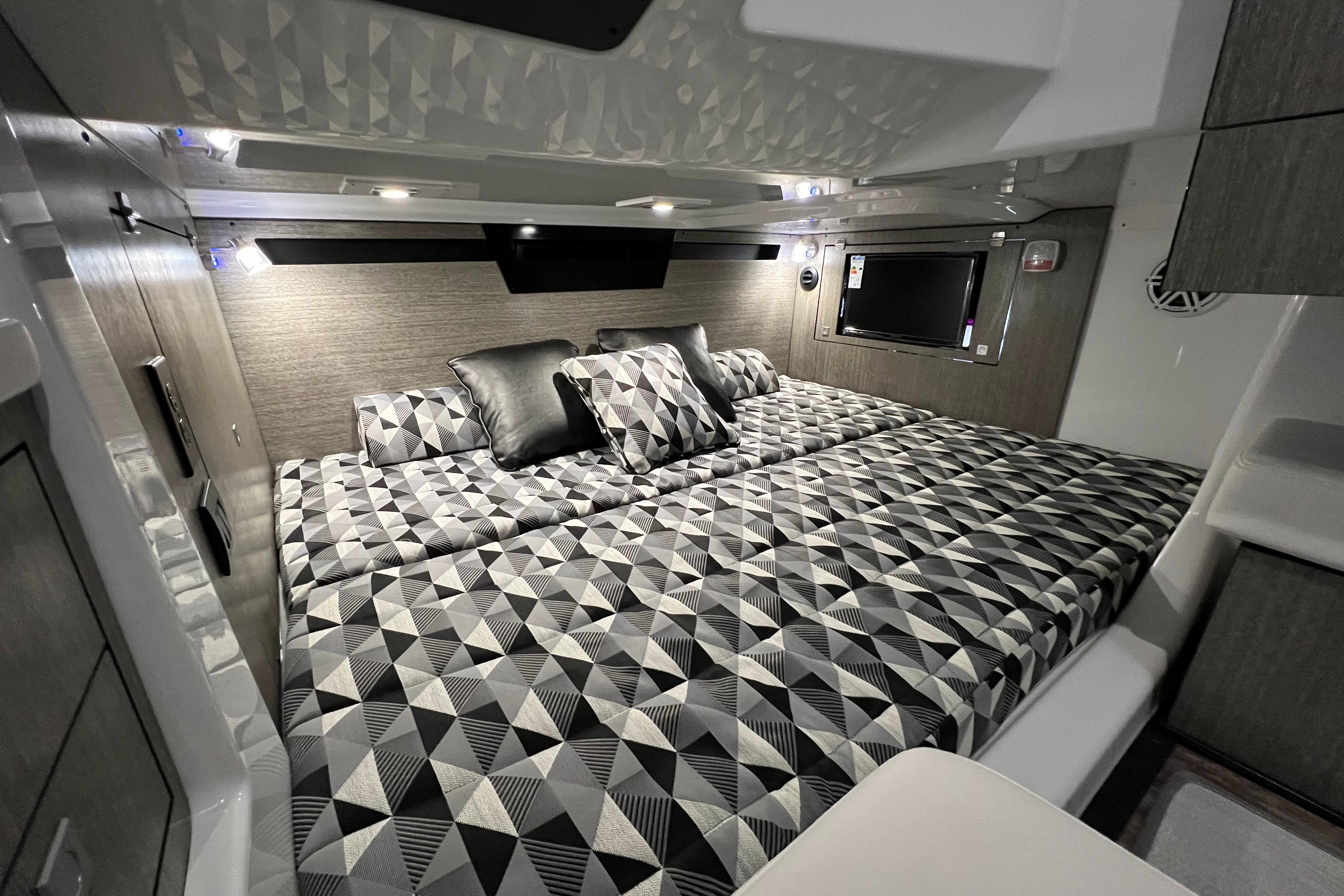 Luxurious cabin interior of 2023 Monterey 378SS Super Sport with geometric bedding design.