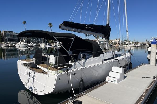 2025 Hanse 360 yacht docked in a sunny marina, featuring sleek design and modern amenities.