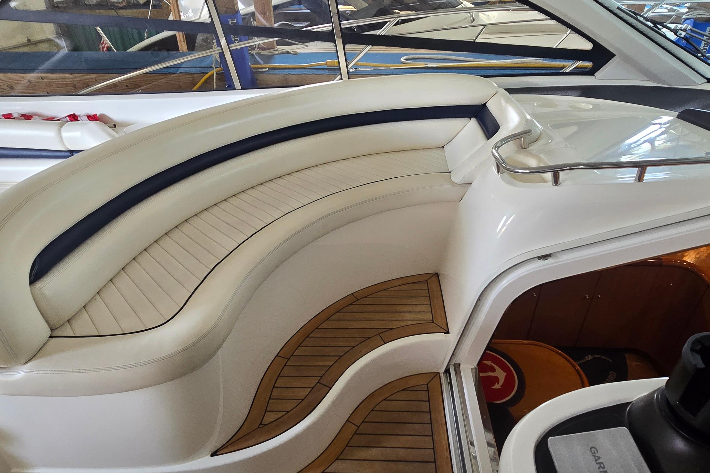 2004 Sunseeker Camargue 50 yacht interior with elegant seating and teak flooring.