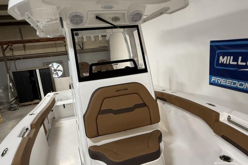 2026 Sea Pro 242 Center Console boat interior with brown seating and modern design.