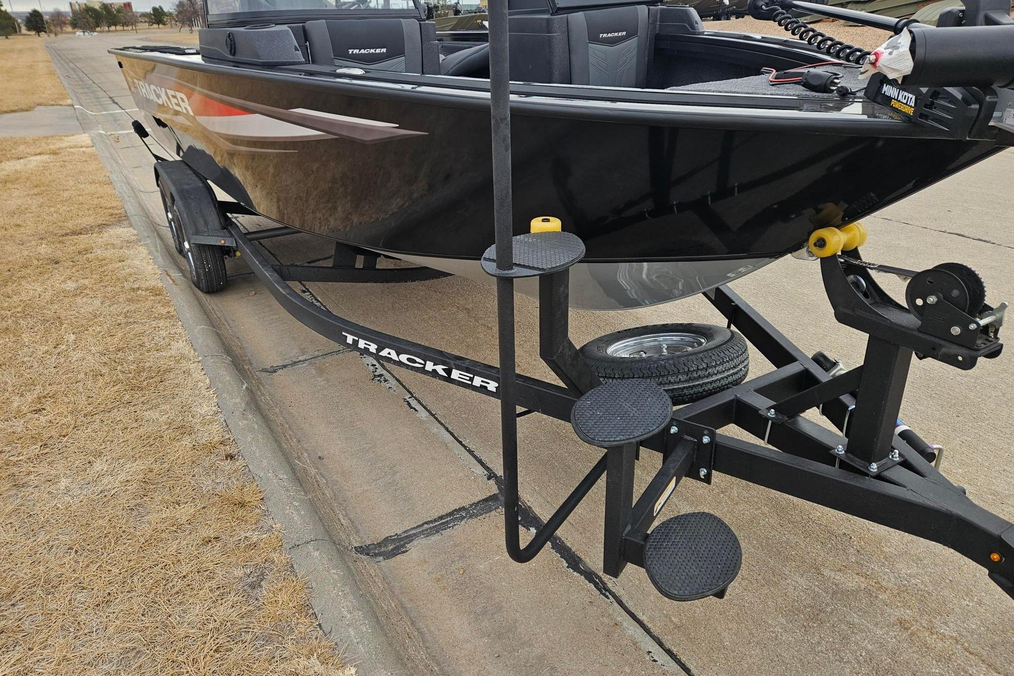 2026 Tracker Targa V-19 WT boat on trailer, parked on roadside.