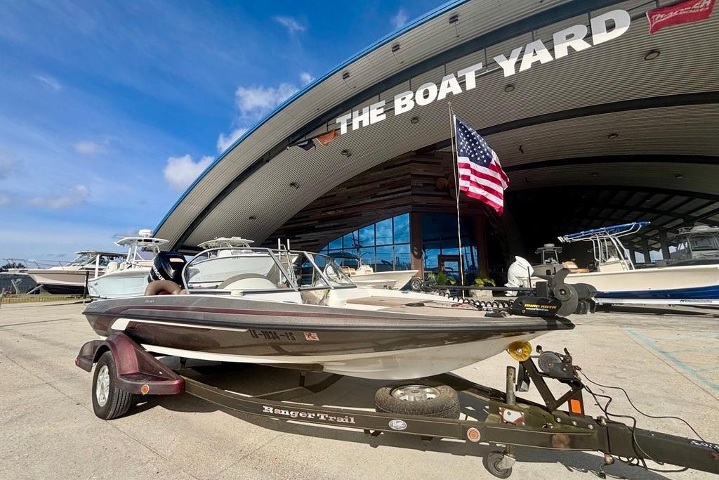 2008 Ranger 180 Reata boat on trailer at The Boat Yard with American flag.