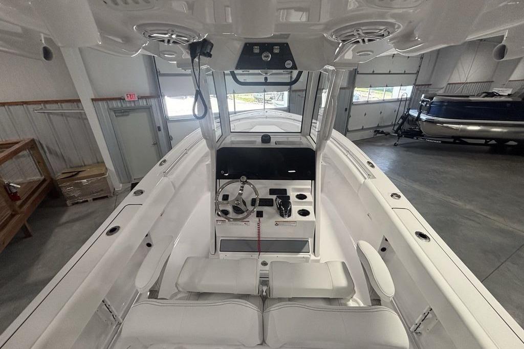 2026 Sportsman Open 252 Center Console boat interior in a showroom.