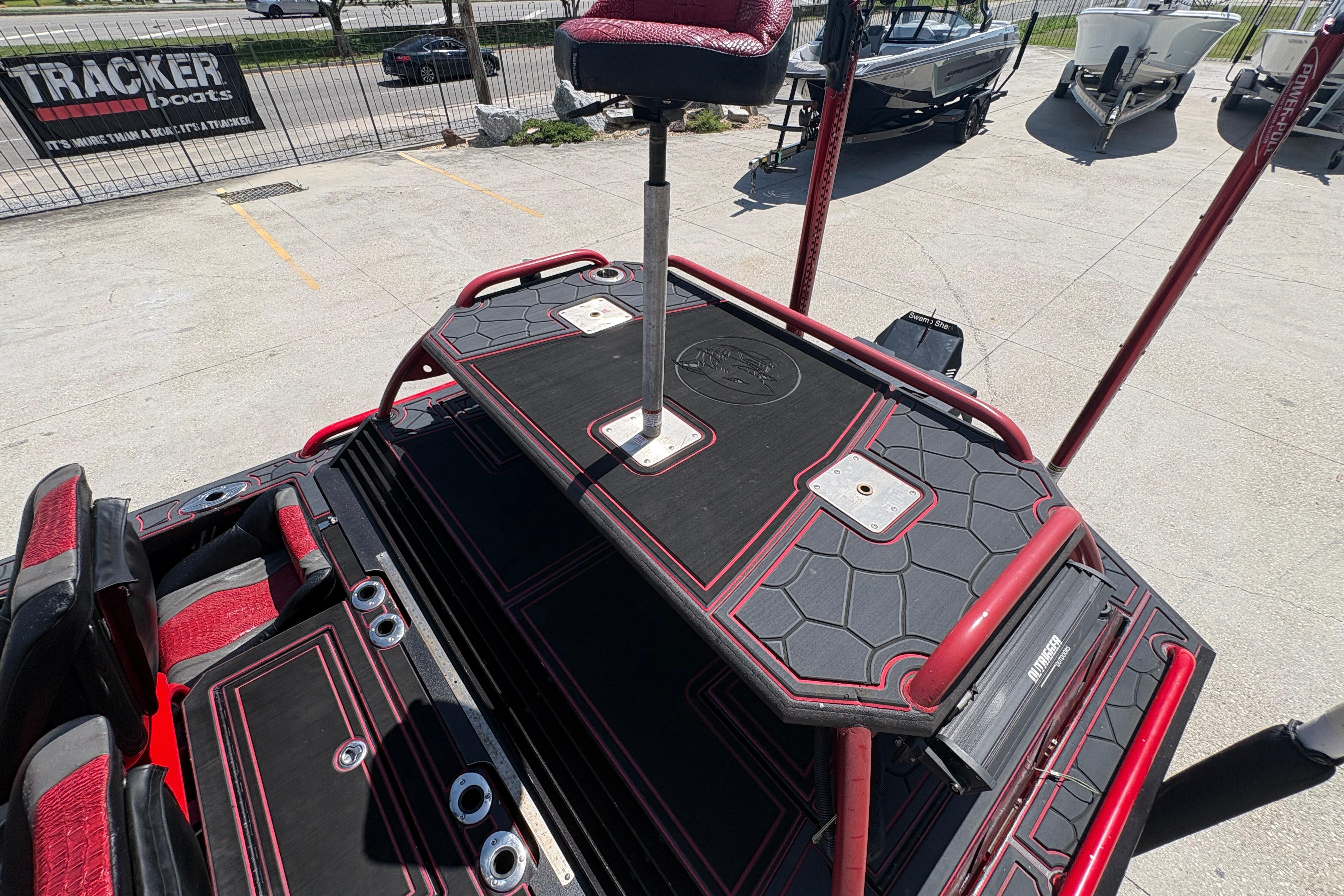 Custom 2018 Swamp Shark 24' boat deck with red accents and seating.