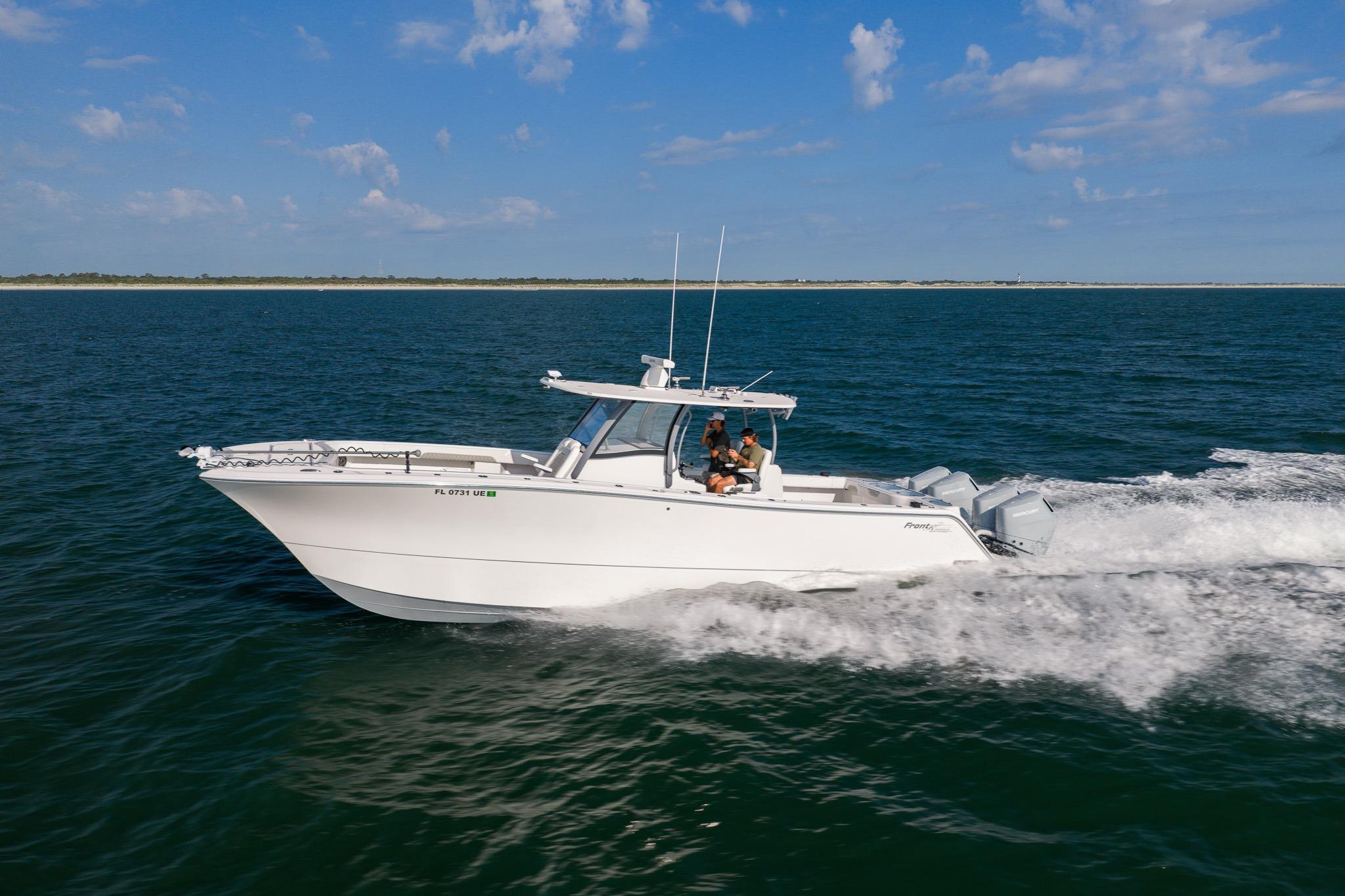 2026 Front Runner 37 Catamaran cruising on open water under a clear blue sky.
