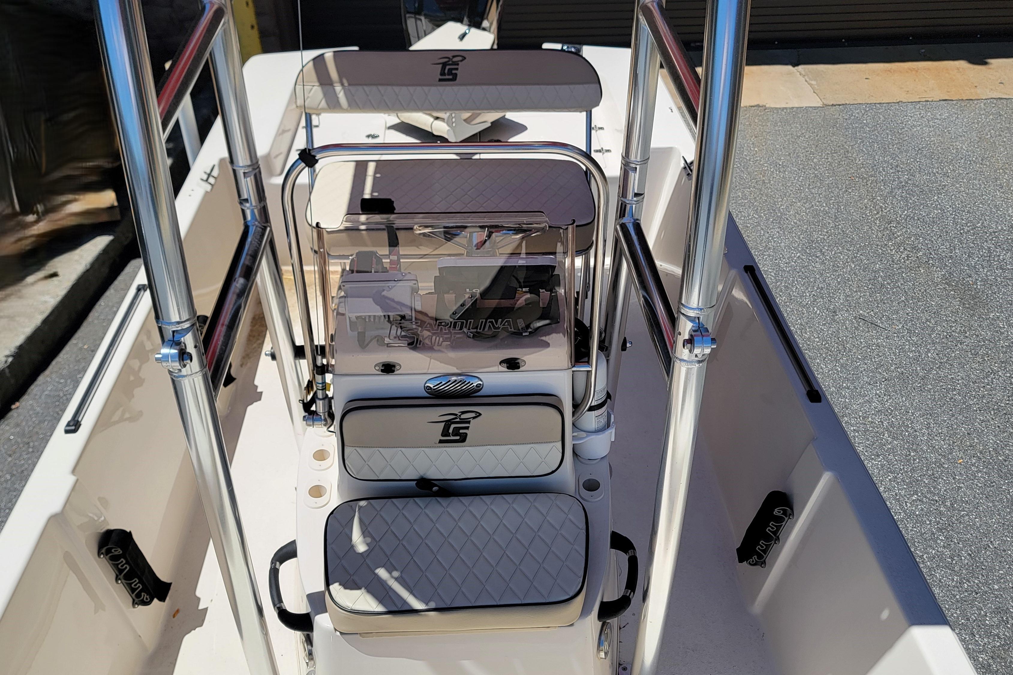 2021 Carolina Skiff 178 JLS boat interior with seating and console, featuring sleek design elements.