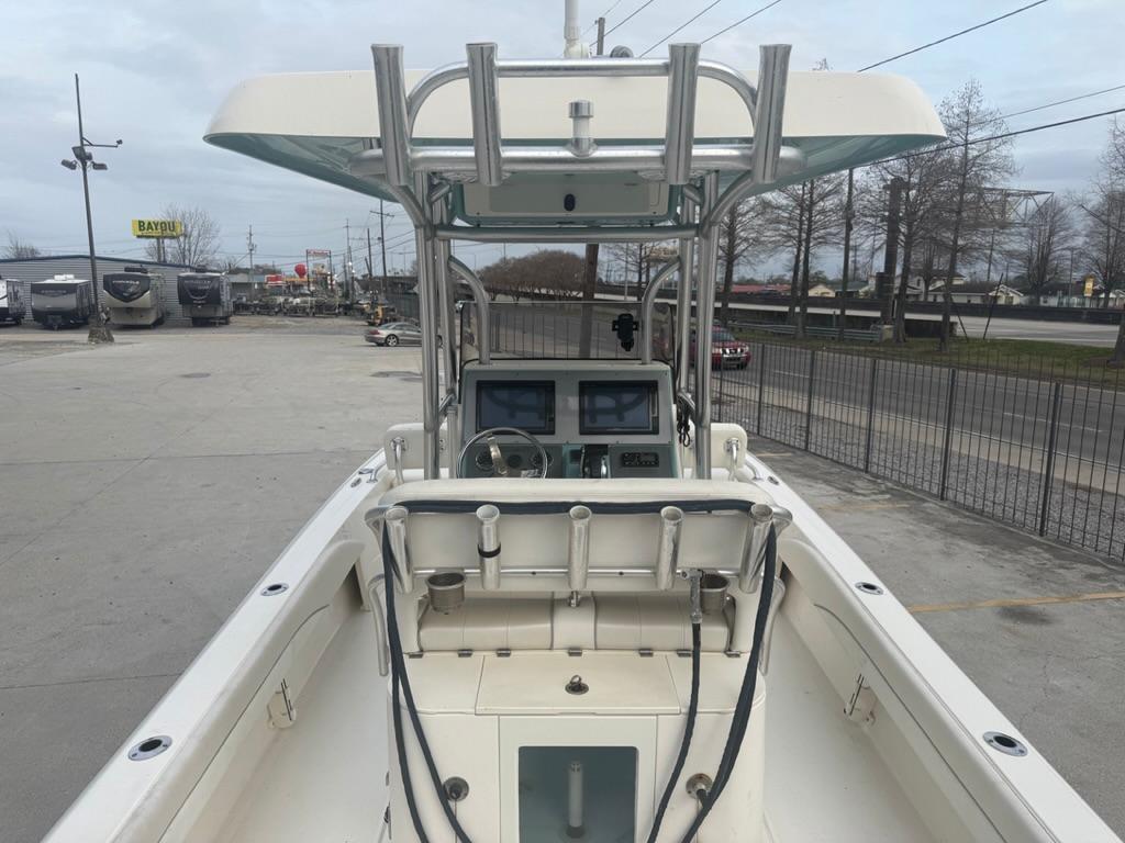 2017 ShearWater 270 Carolina Flare boat with dual consoles and T-top in a parking lot.