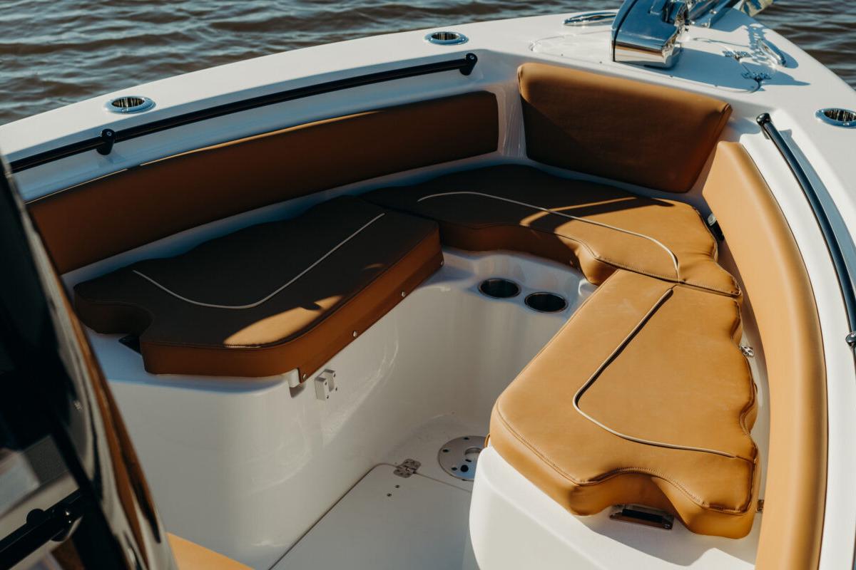 Manufacturer Provided Image: 2025 Key West 239 FSR boat interior with tan cushioned seating and cup holders.