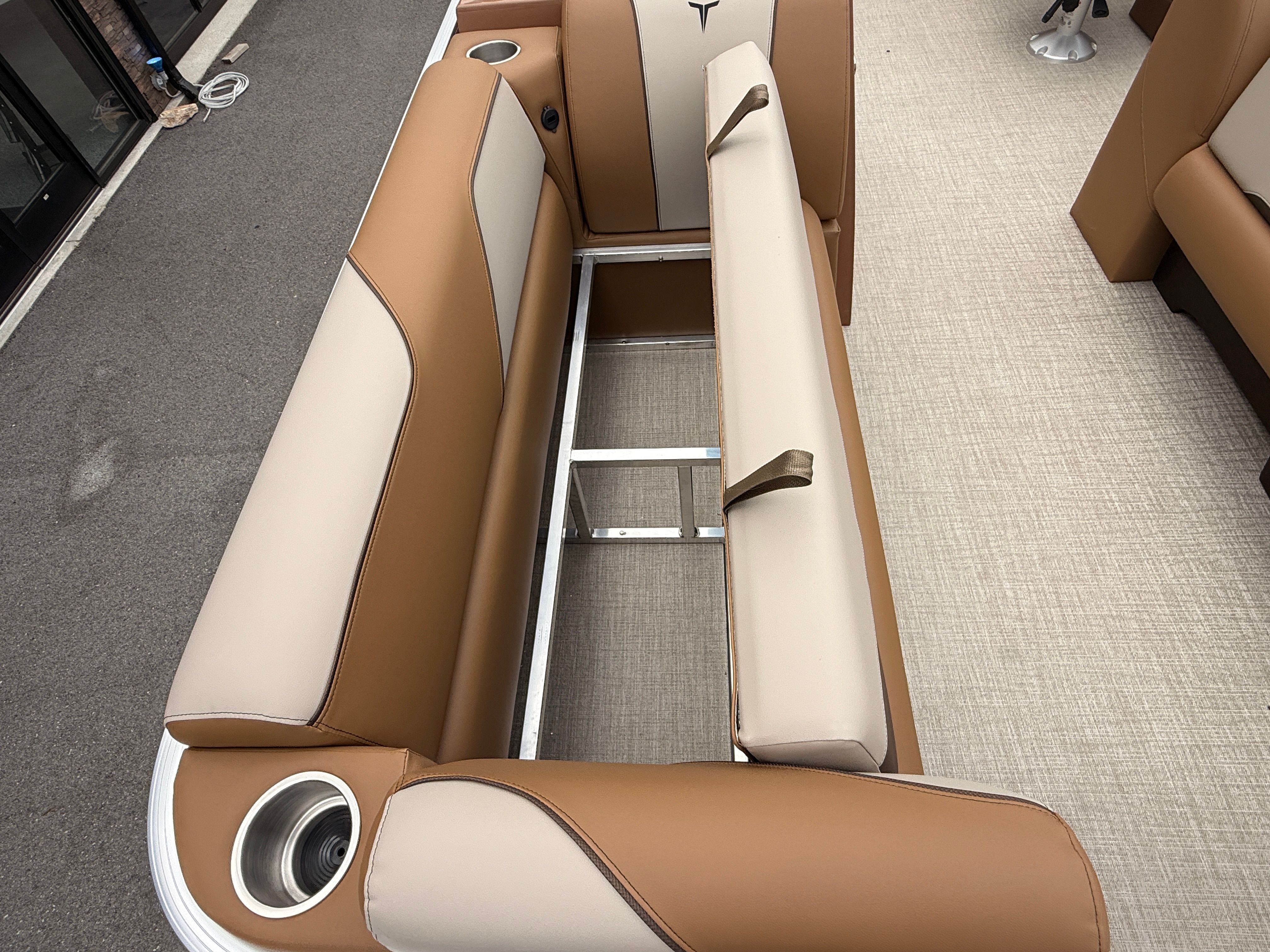 Interior of 2026 Tahoe 2380 Sport Quad Lounger with beige and brown upholstery.