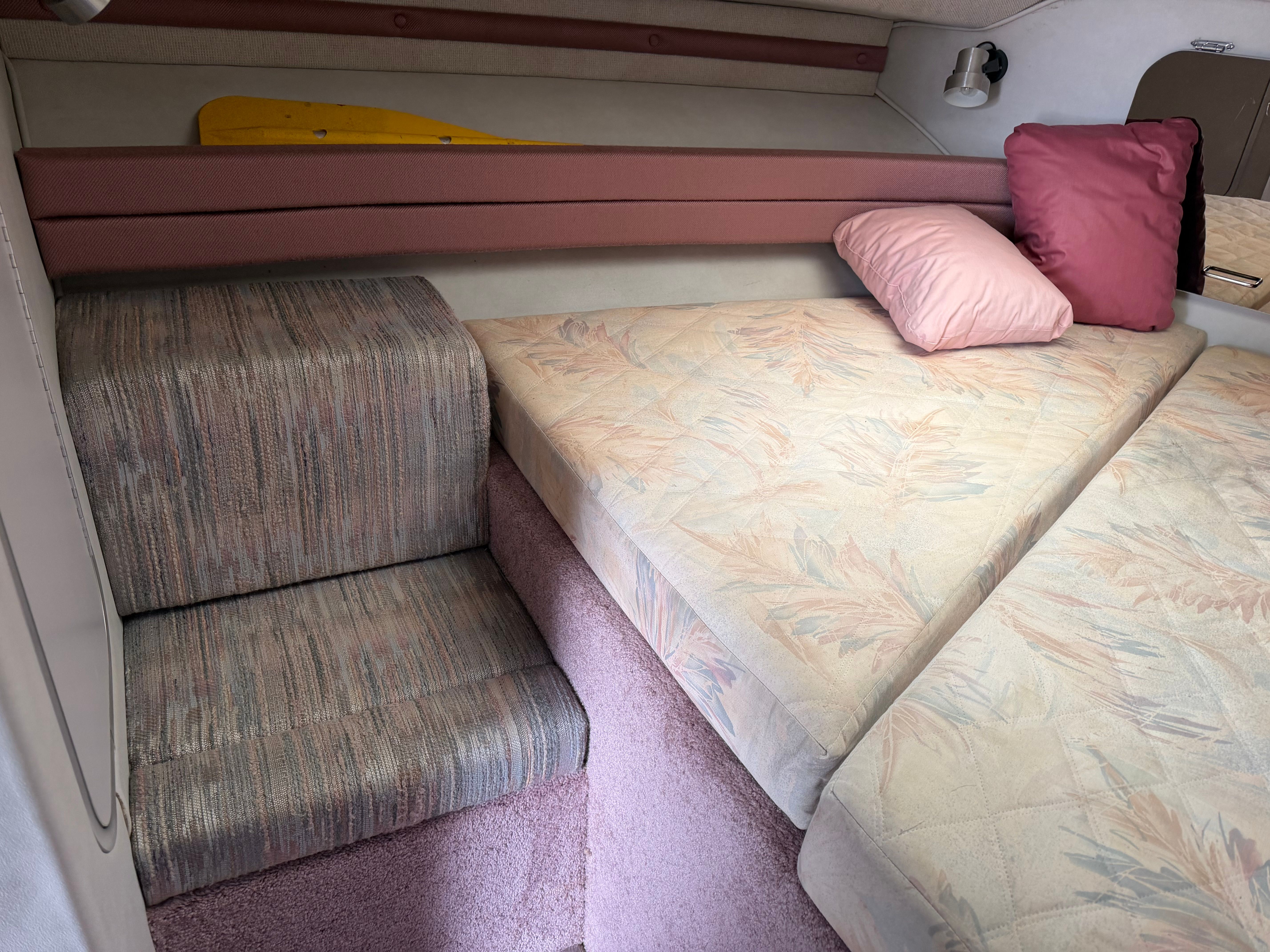 1990 Chaparral Signature 30 interior with cushions and upholstery.
