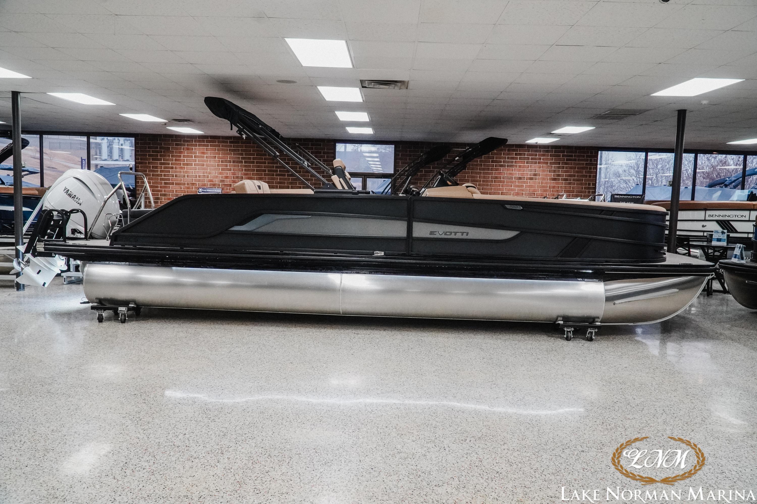 2026 Evotti 725CS pontoon boat displayed indoors at Lake Norman Marina.