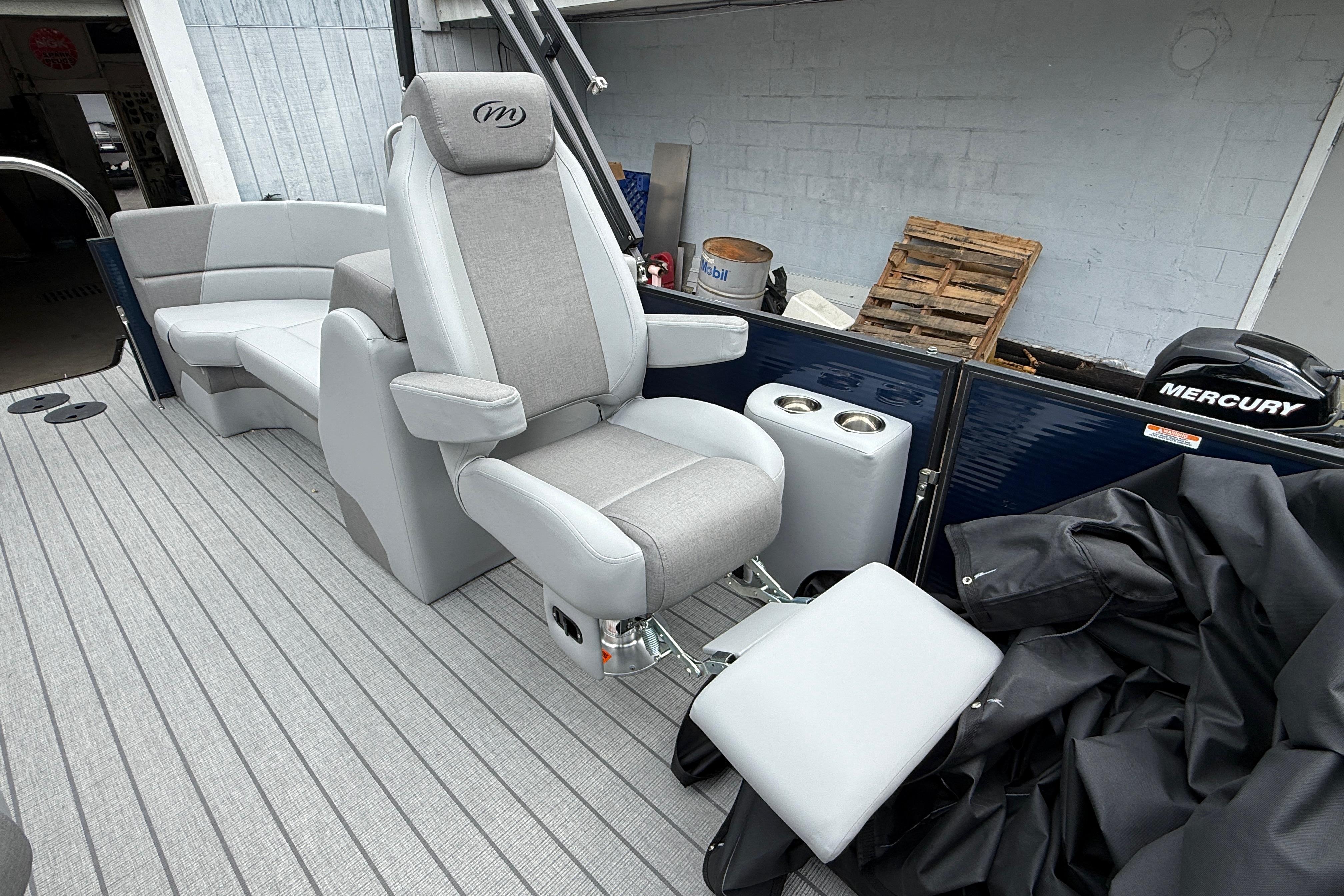Luxurious seating on 2027 Manitou Aurora RF 23 pontoon boat with Mercury engine.