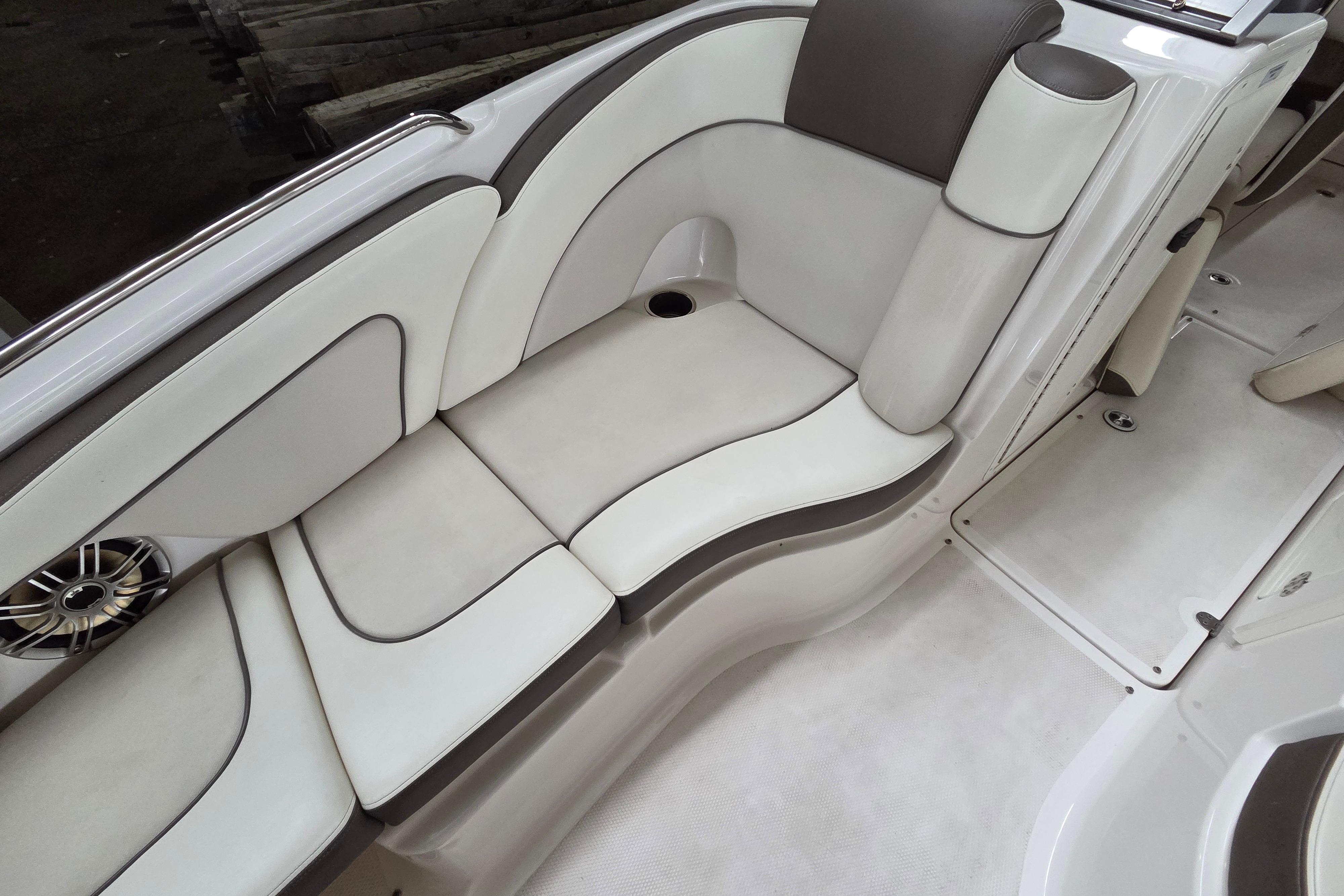 2013 Yamaha 242 Limited S boat interior with white and gray seating.