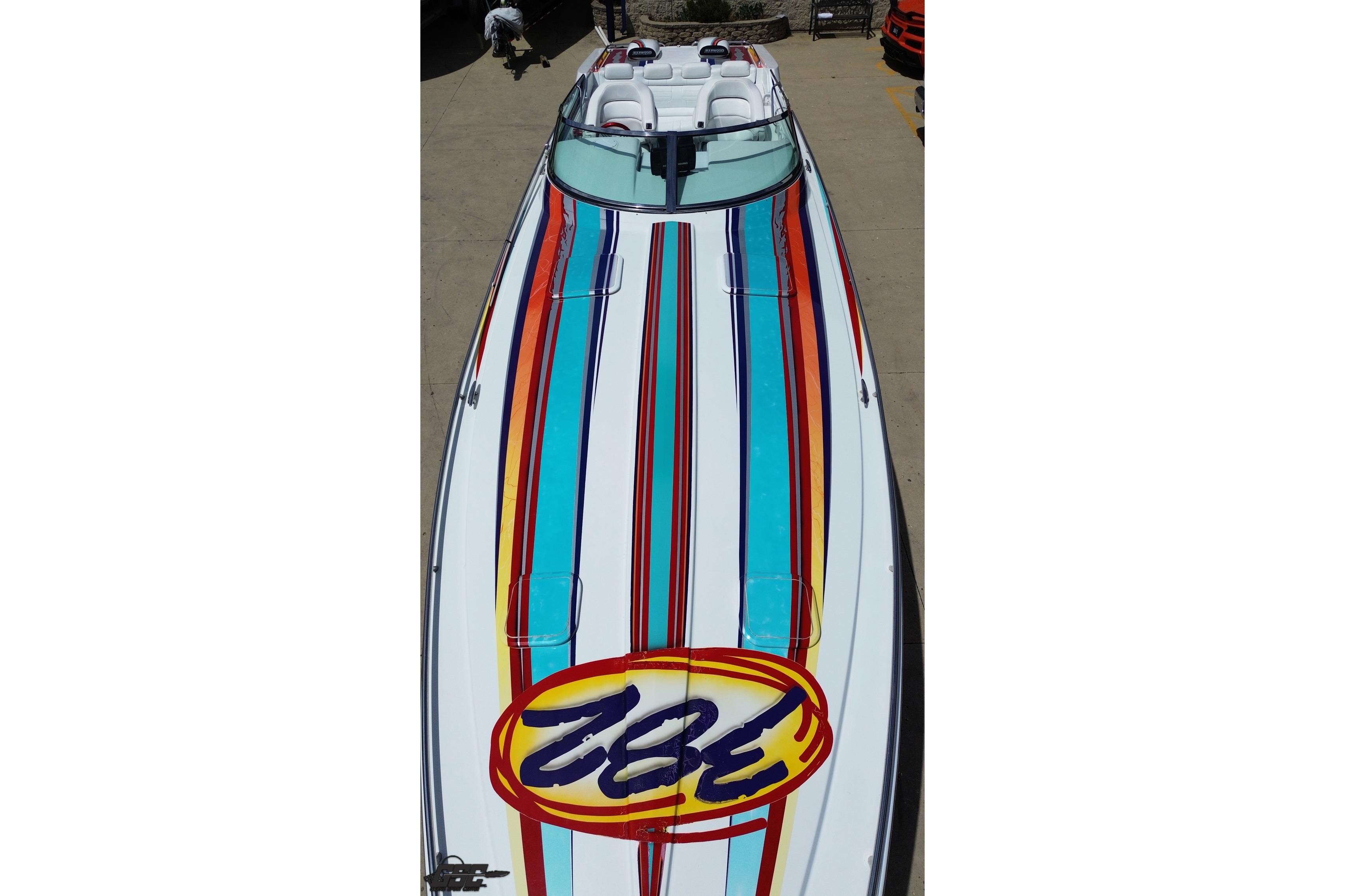 2002 Formula 382 FASTech boat with vibrant striped design and sleek cockpit.