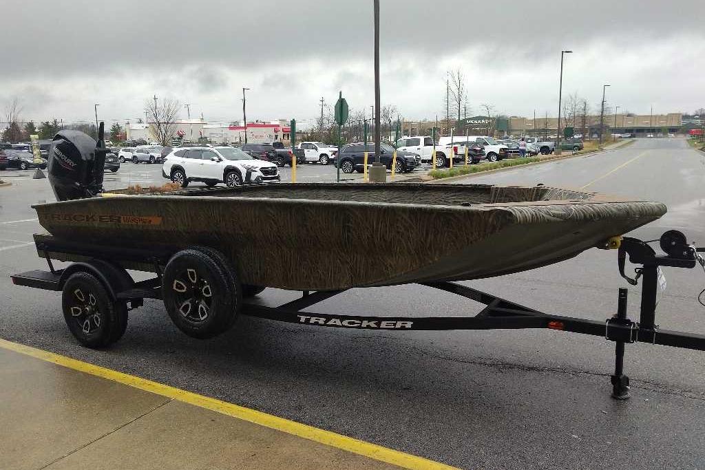 2026 Tracker Grizzly 1756 T Marsh boat on trailer in parking lot.