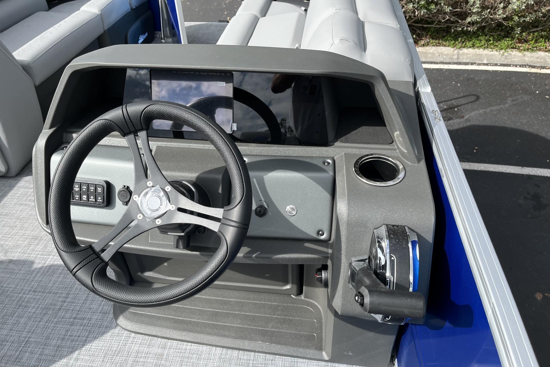 Steering console of 2026 Sun Tracker Party Barge 20 DLX pontoon boat.
