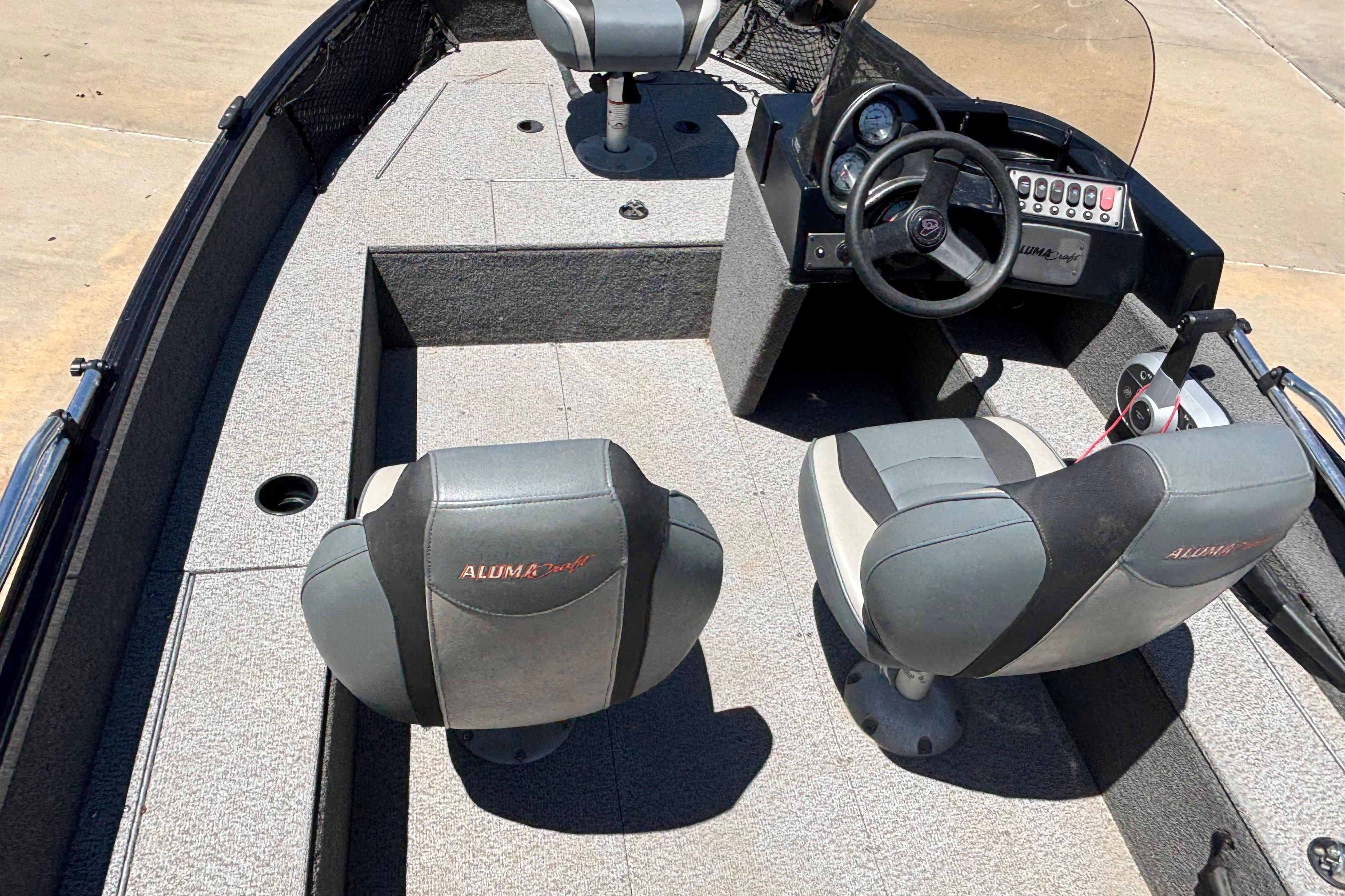 2021 Alumacraft Classic 165 boat interior with steering console and seating.