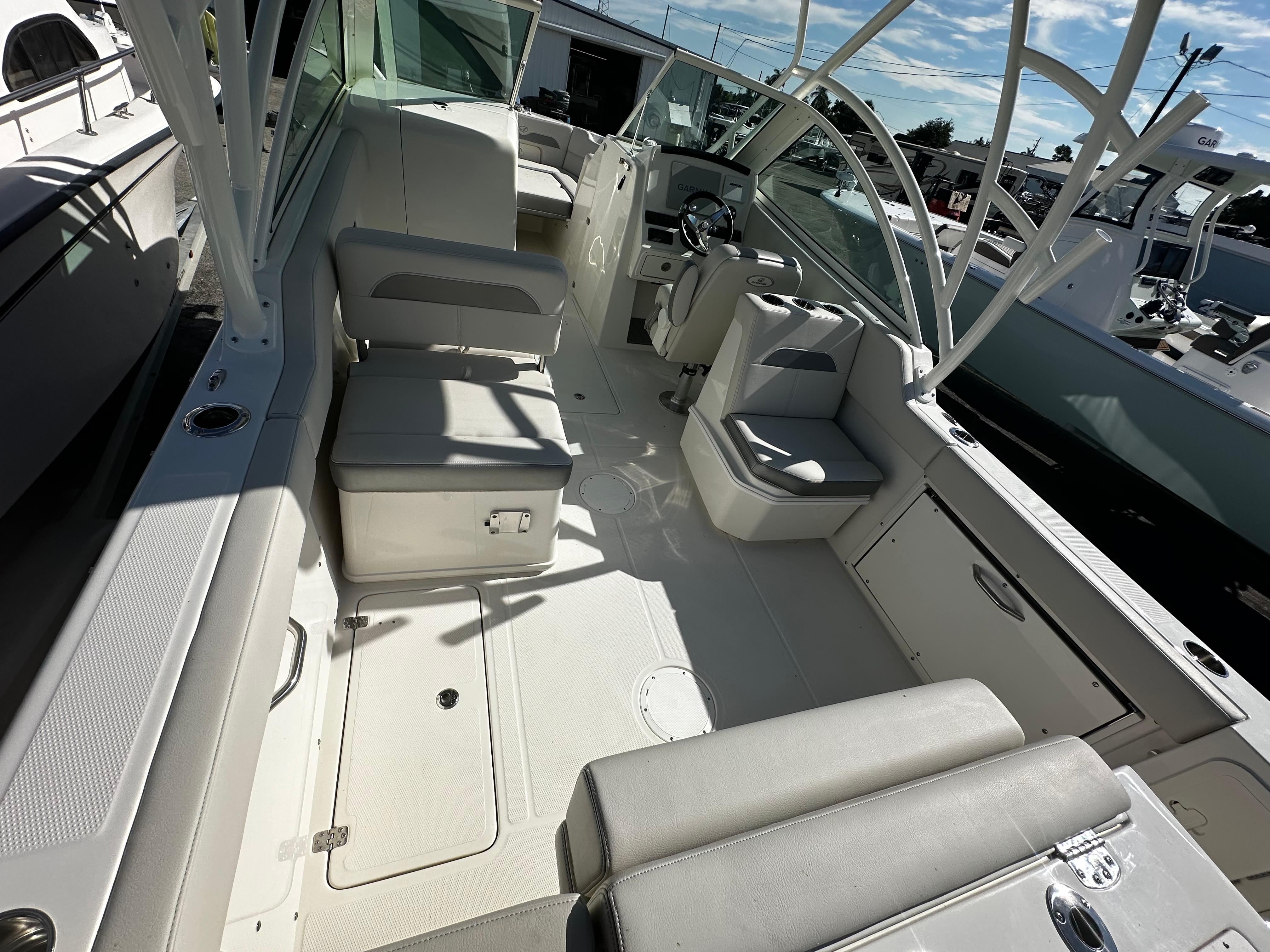 2025 Sailfish 245 DC boat interior with seating and helm station.