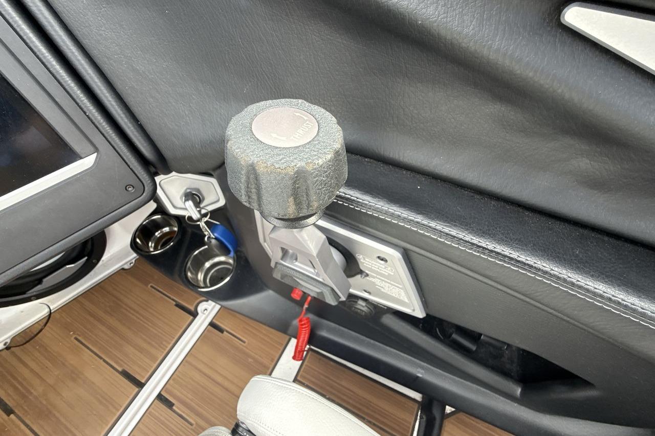 2024 Supra SA 550 interior detail with control knob and cup holders.