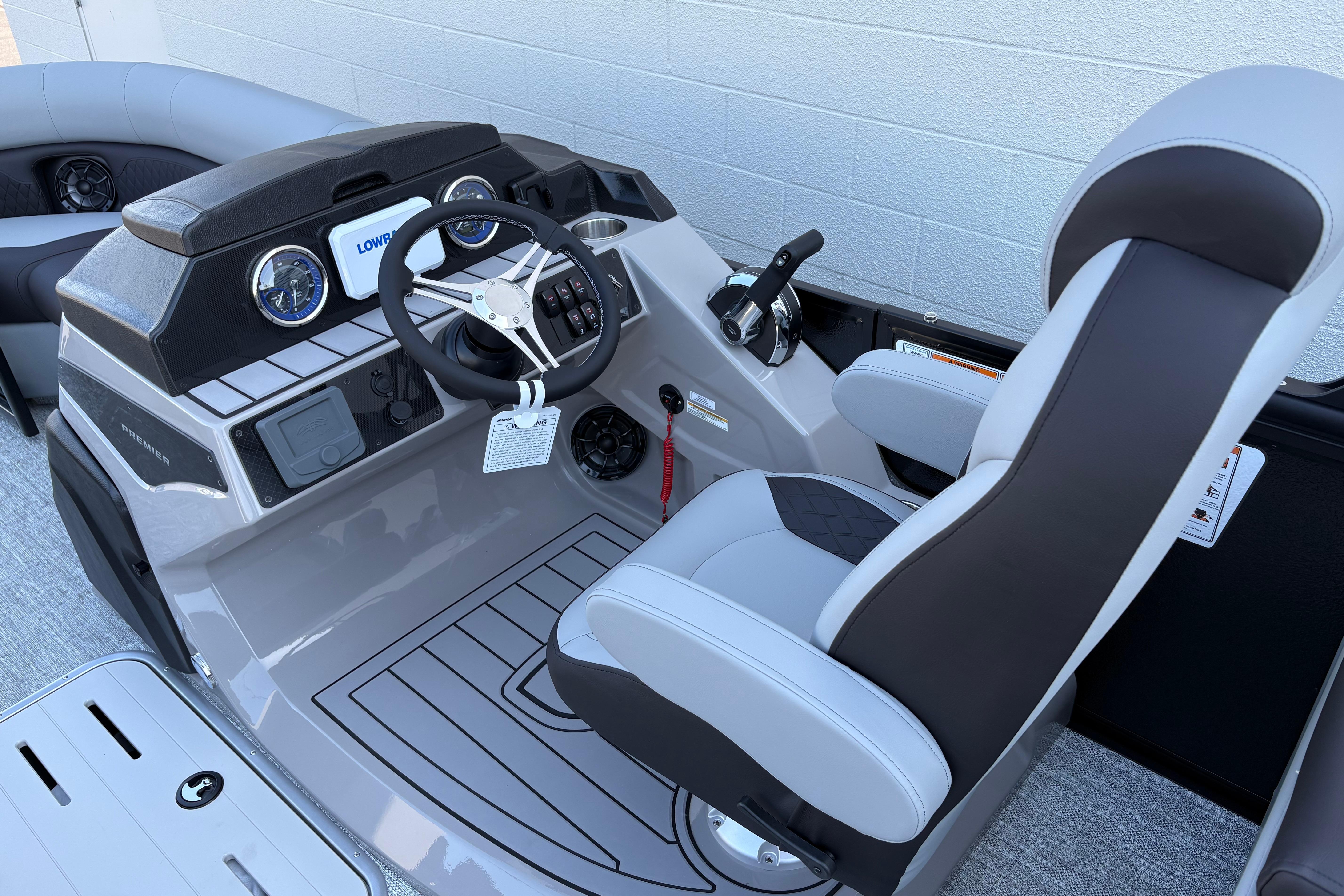 2026 Premier 210 Sunsation RF boat cockpit with modern steering and controls.