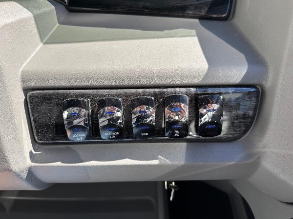 Control panel of 2025 Tahoe Pontoon 2585 LTZ Entertainer with labeled switches.