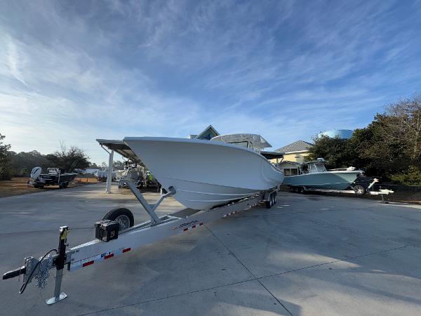 2025 Yellowfin 39 Offshore boat on trailer, parked outdoors under a clear sky.