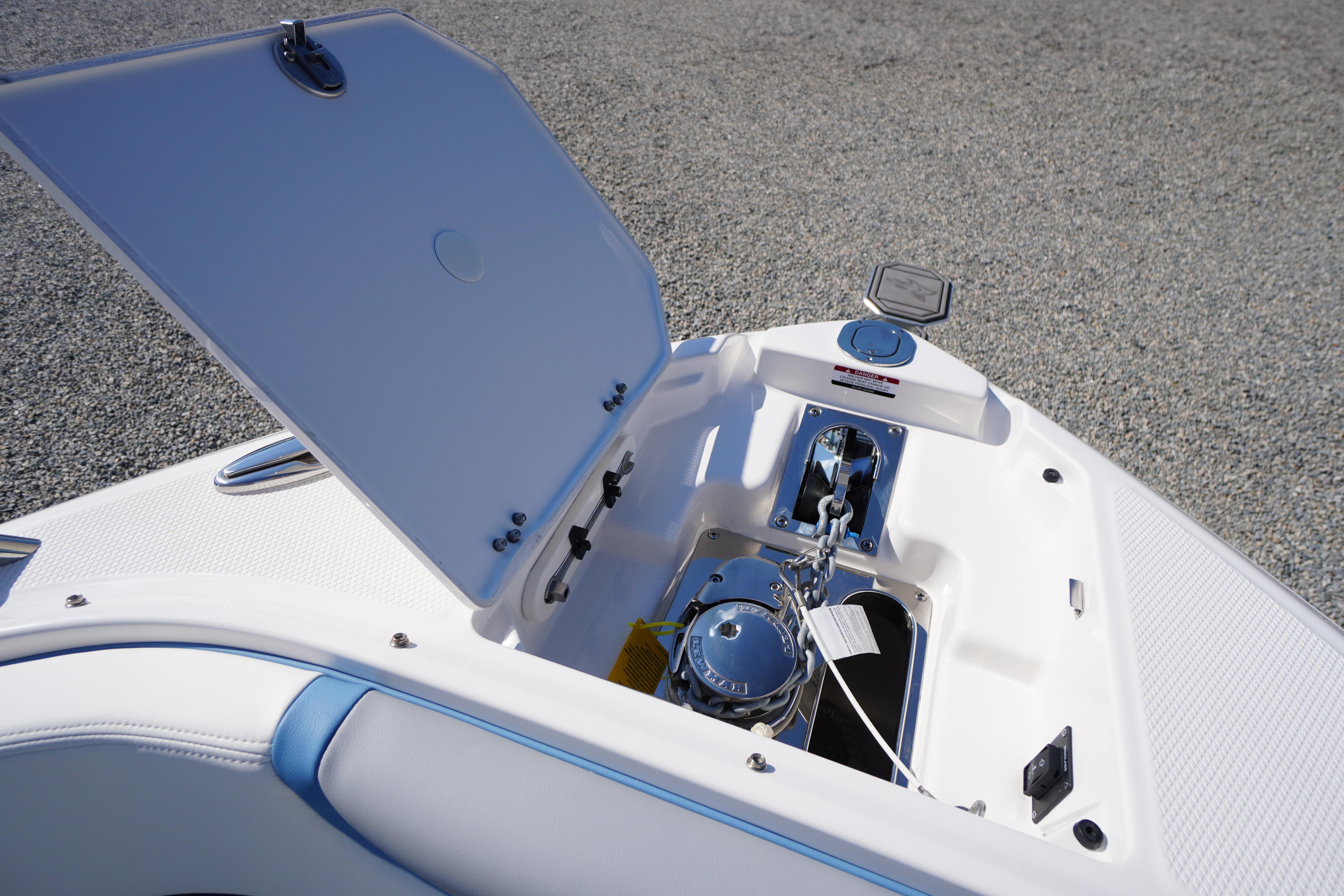 Open anchor compartment on 2026 Chaparral 270 OSX boat, showcasing modern design and functionality.