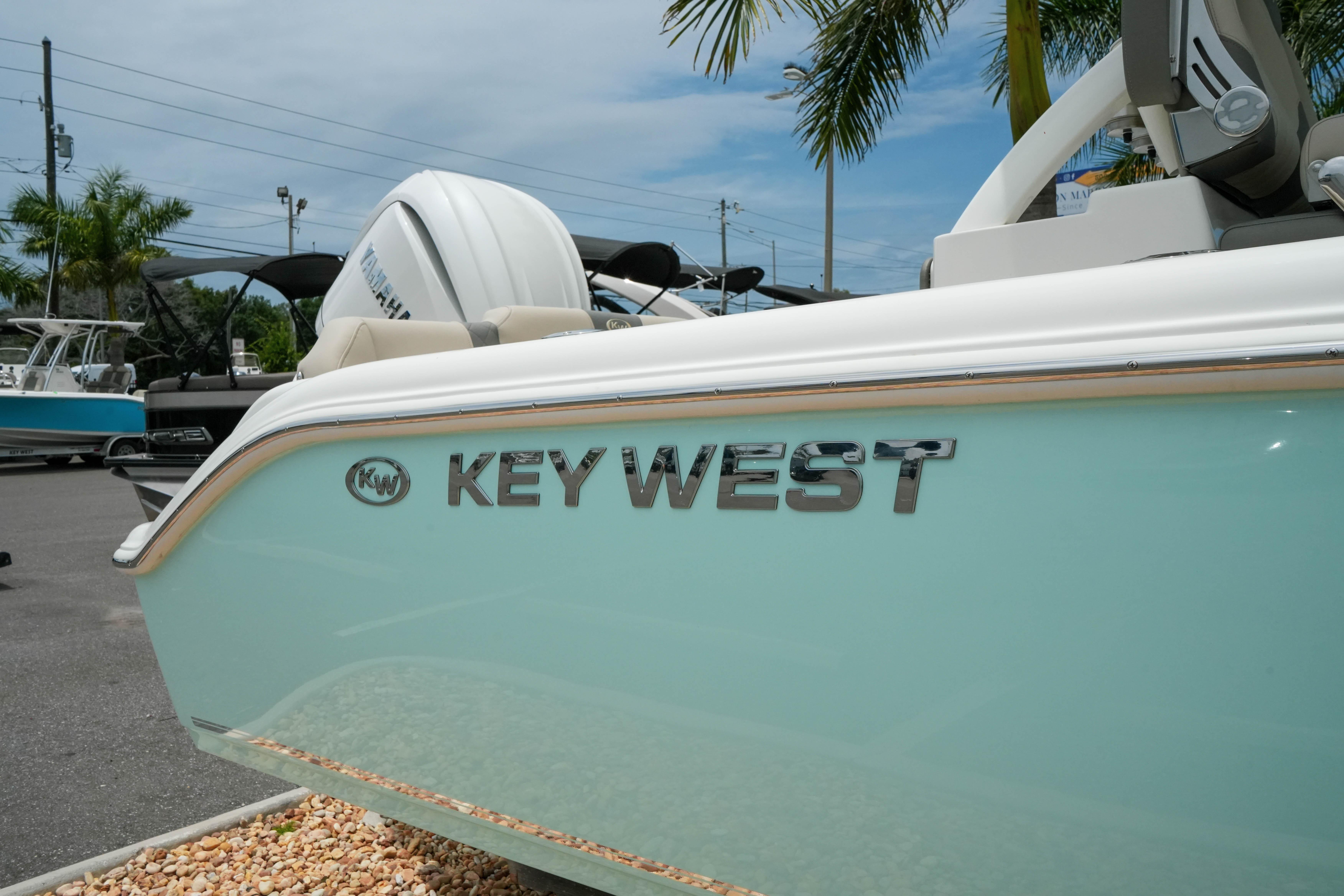 2026 Key West 239 FS boat with Yamaha engine, displayed outdoors.