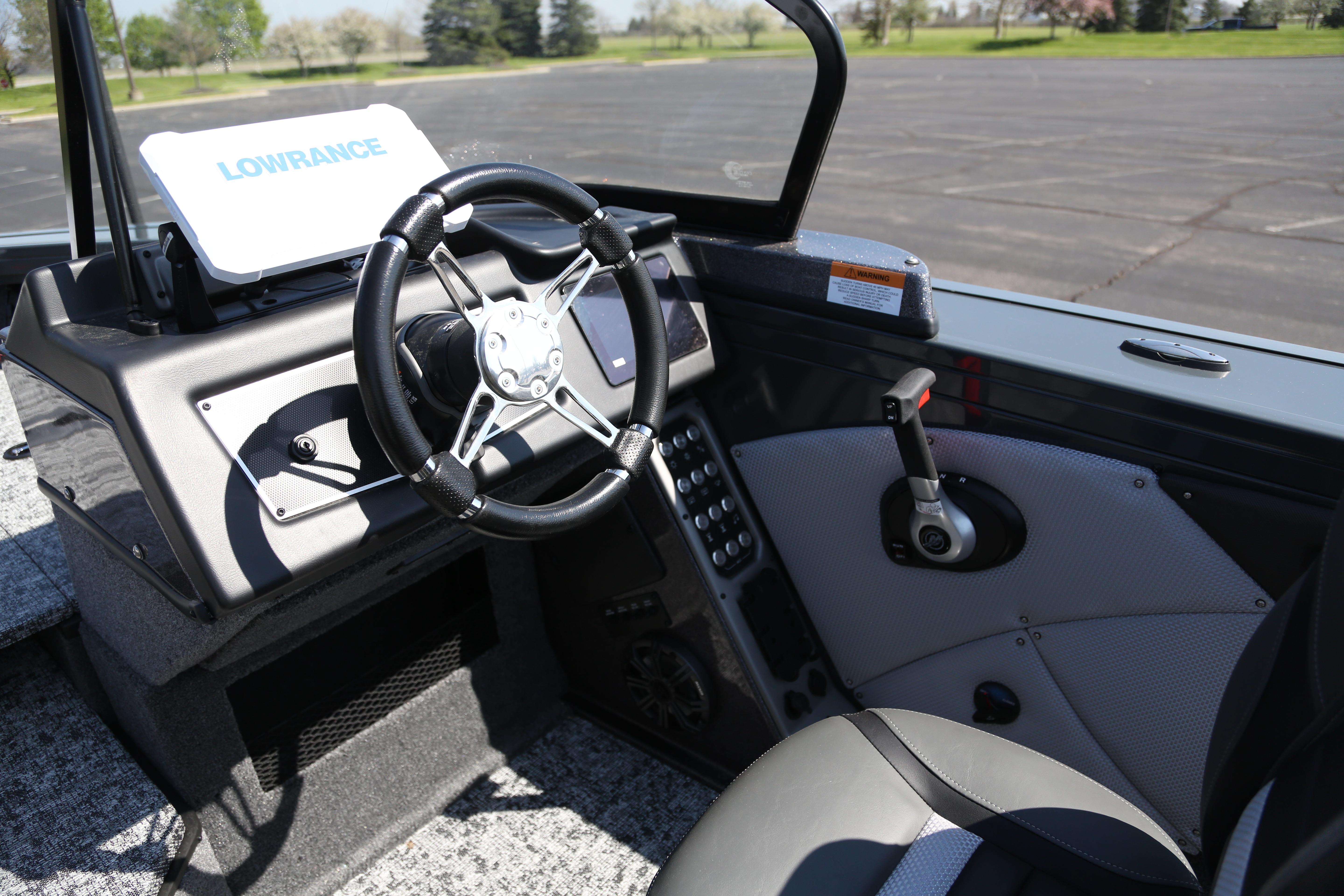 2026 Ranger VX1888 WT boat cockpit with steering wheel and Lowrance navigation system.