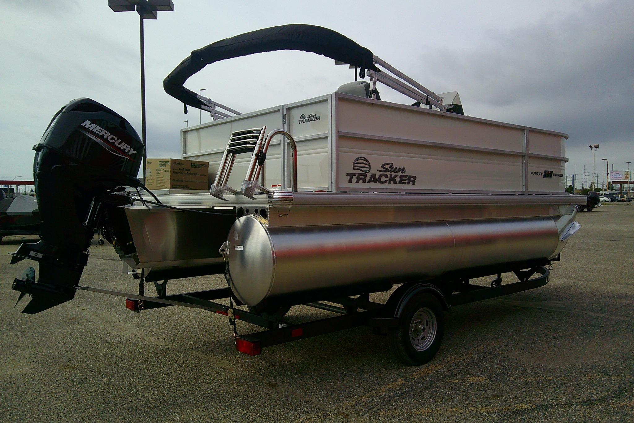 2026 Sun Tracker Party Barge 16 DLX pontoon boat with Mercury outboard motor.