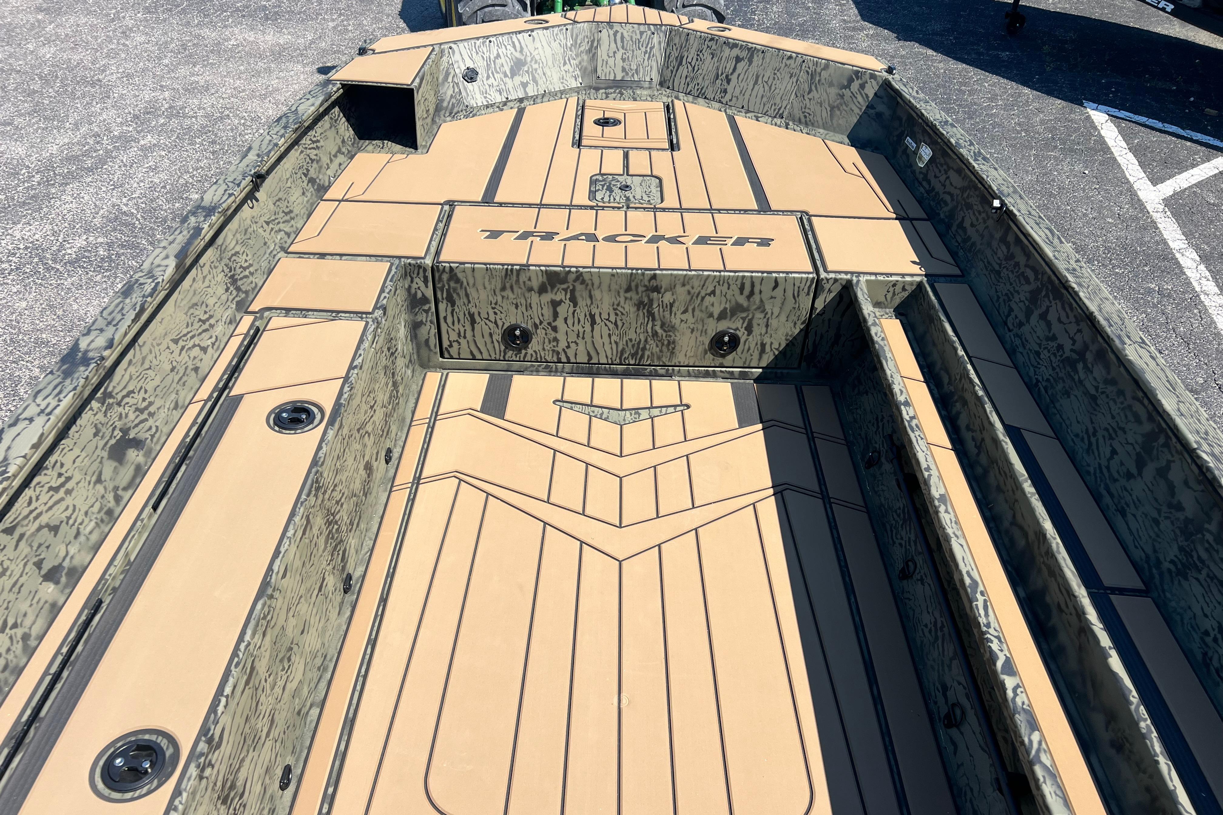 2026 Tracker Grizzly 1756 T Marsh boat interior with camouflage design and spacious layout.