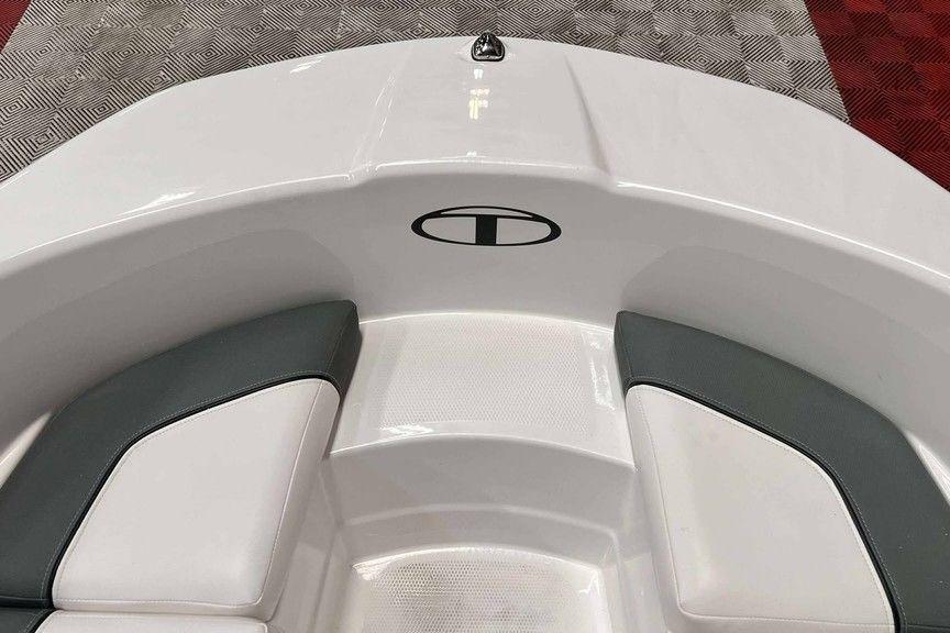 2026 Tahoe T16 boat interior with white and gray seating on patterned flooring.