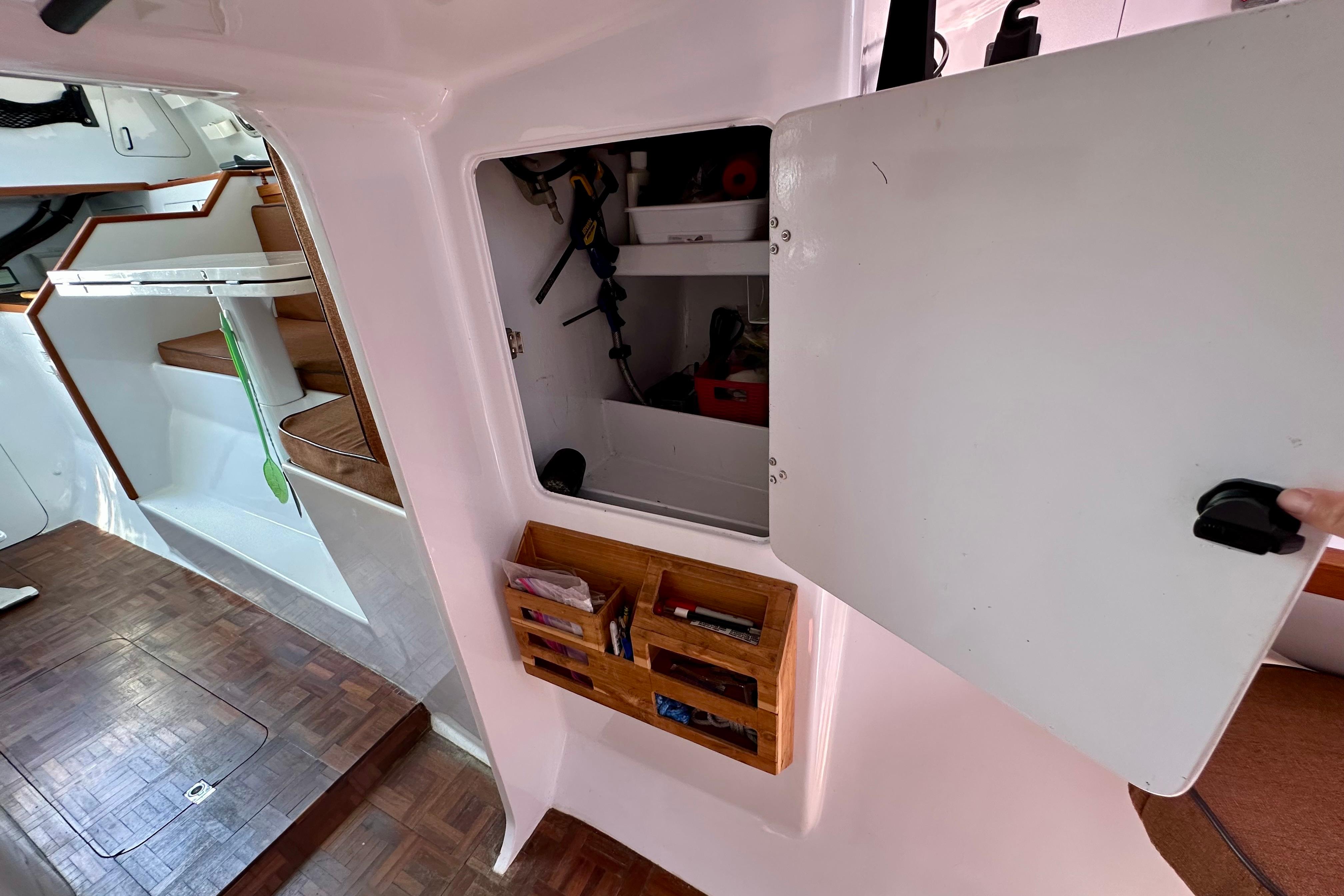 Interior of a 2012 Hughes 40 sailboat with open storage compartment.