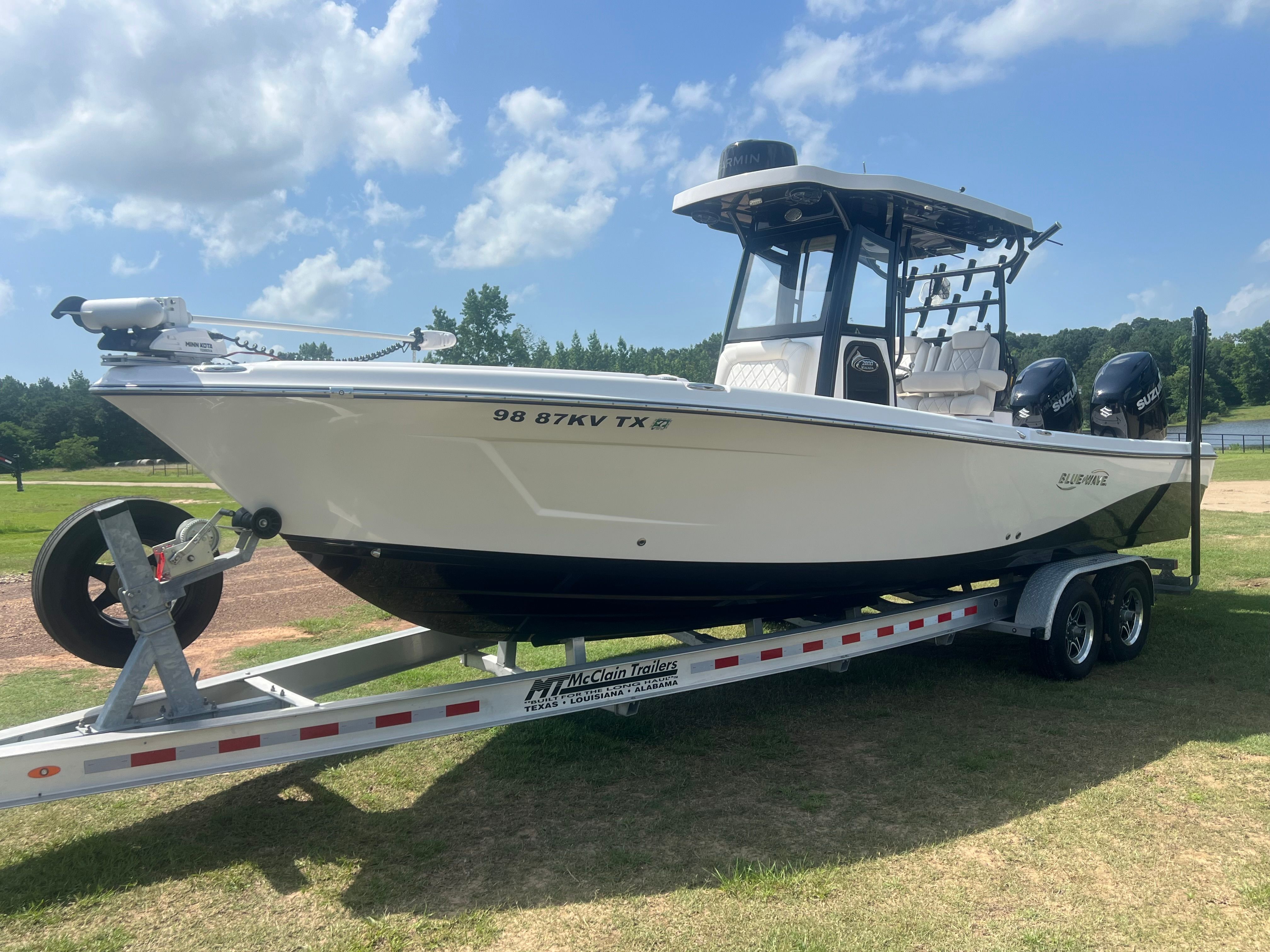 A 2023 Blue Wave 2800 Makaira on a trailer, ready for the water.