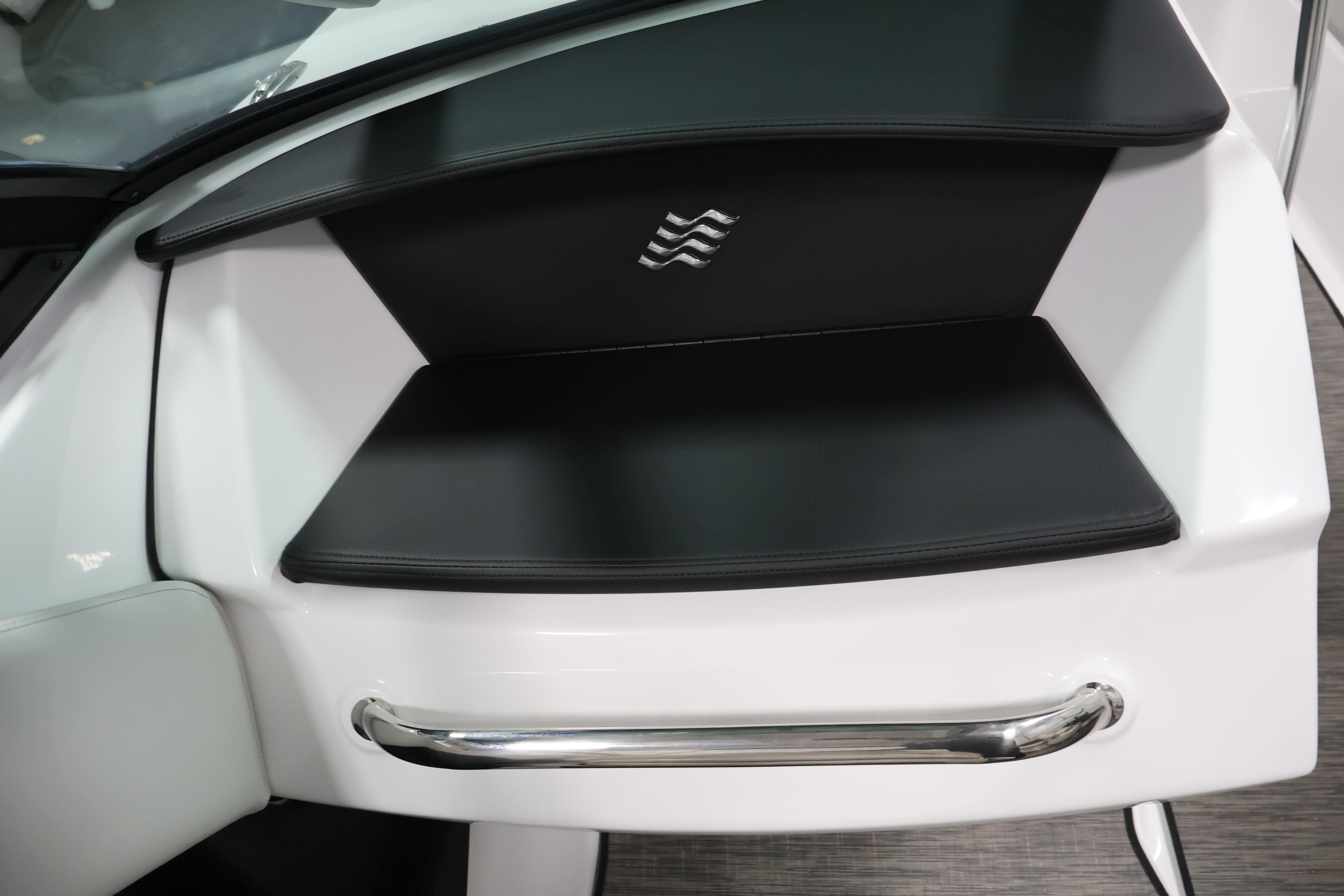 2026 Four Winns H4 Freedom boat interior with sleek black and white seating design.