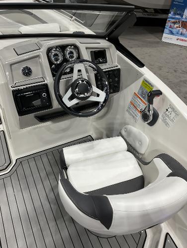 2024 Starcraft SVX 190 OB DC boat cockpit with steering wheel and control panel.