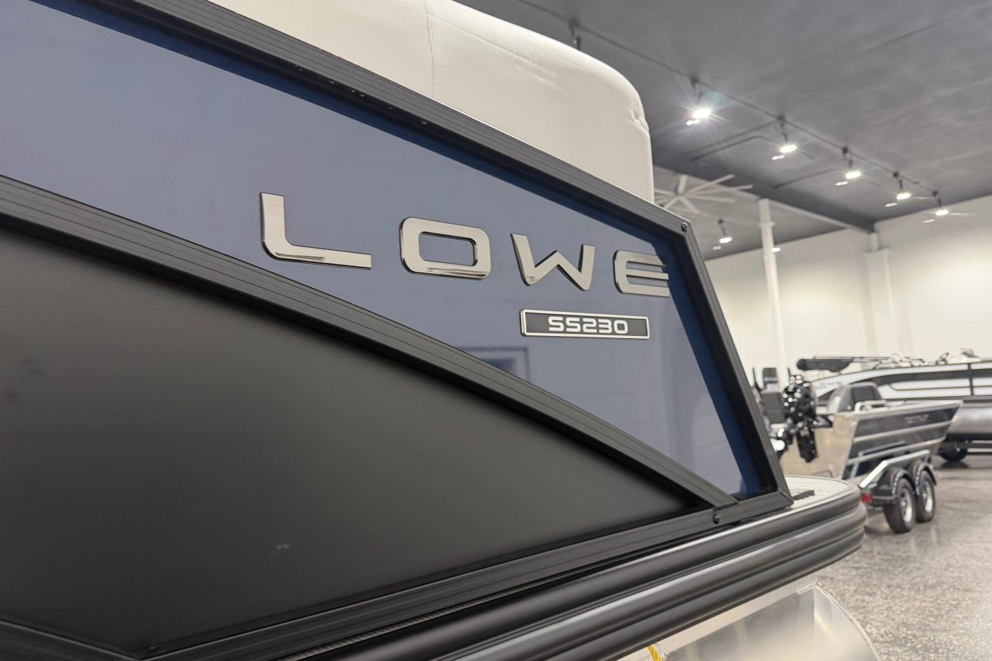 2026 Lowe SS 230 WT boat displayed in a showroom with sleek design.